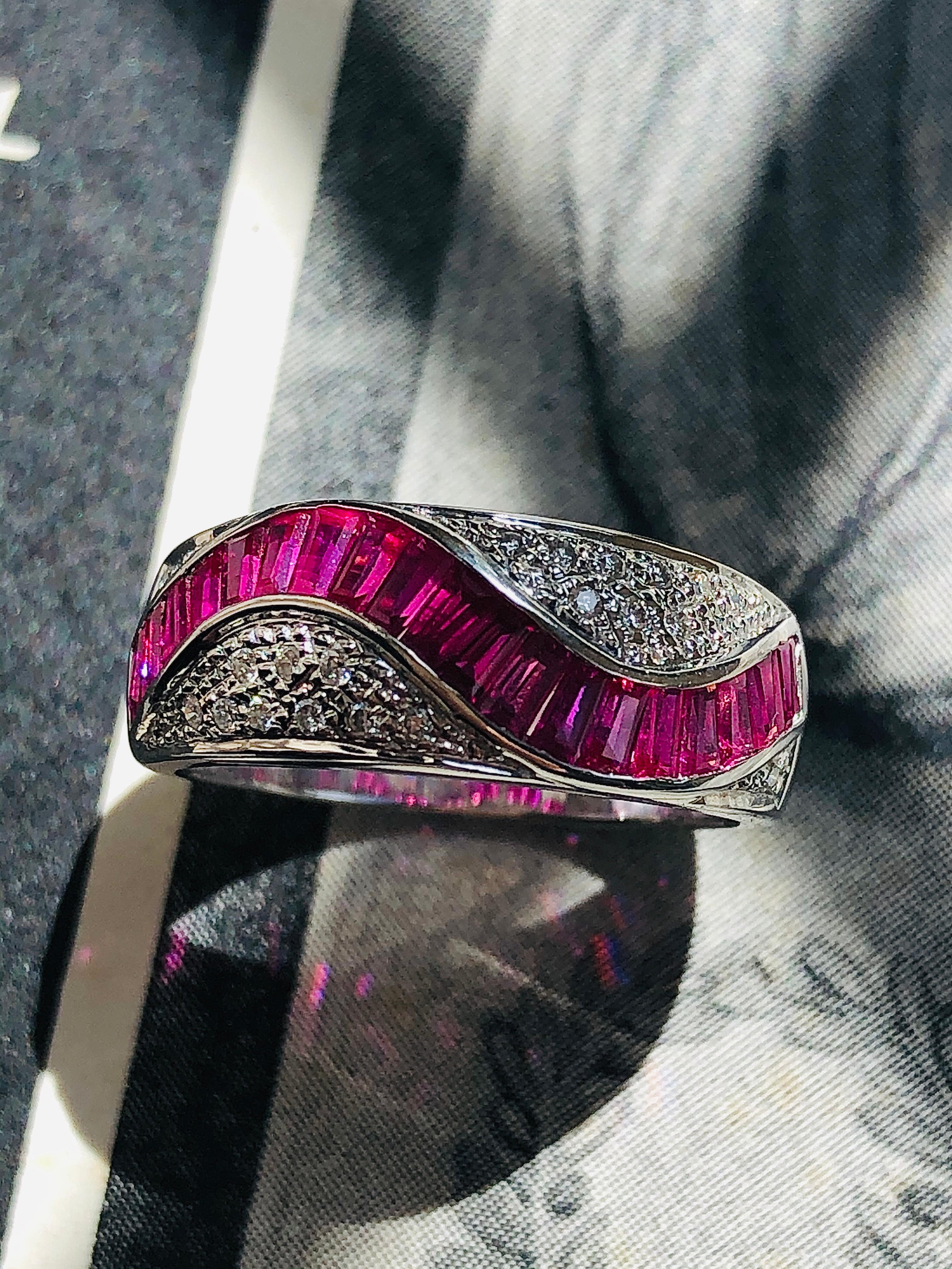 An incredibly stylish and vintage, Ruby and Diamond Ring. This simple and chic design is actually fiendishly difficult to produce, requiring perfectly sized rubies and variety of different setting techniques. The tapered-cut rubies would have been
