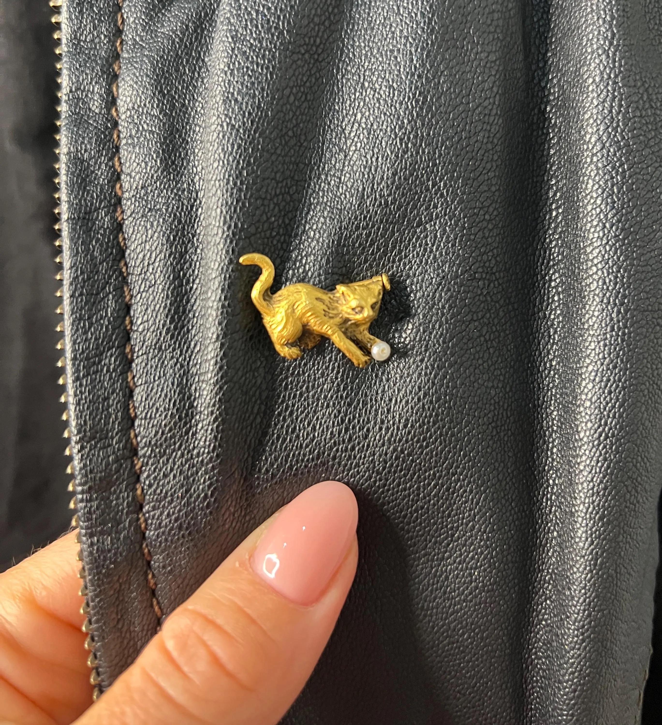 Vintage Cat Brooch

18ct Gold

Circa 1940s

This exquisite 18ct yellow gold brooch, dating back to the 1940s, captures the playful spirit of a beloved feline friend. Elegantly designed, it features a delightful cat poised in a playful stance,