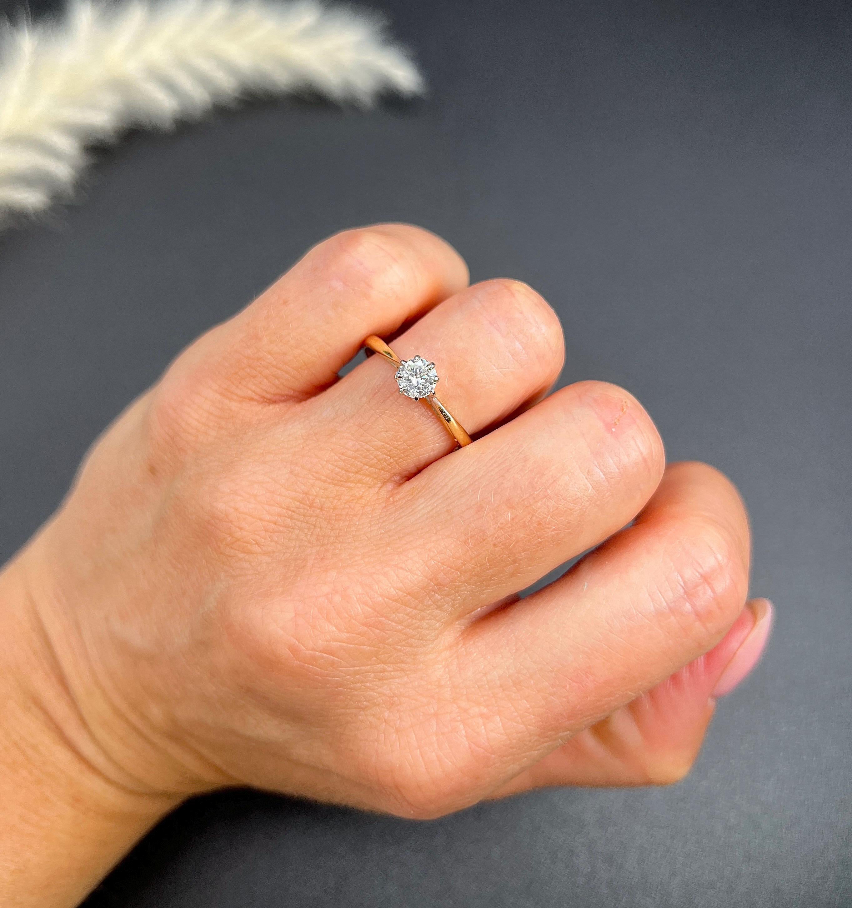 Vintage Engagement Ring

18ct Yellow Gold- Stamped 750

Makers Mark A L 

Step back in time with this exquisite vintage engagement ring from the 1990s, showcasing timeless elegance and craftsmanship. Crafted from 18ct yellow gold, this ring features
