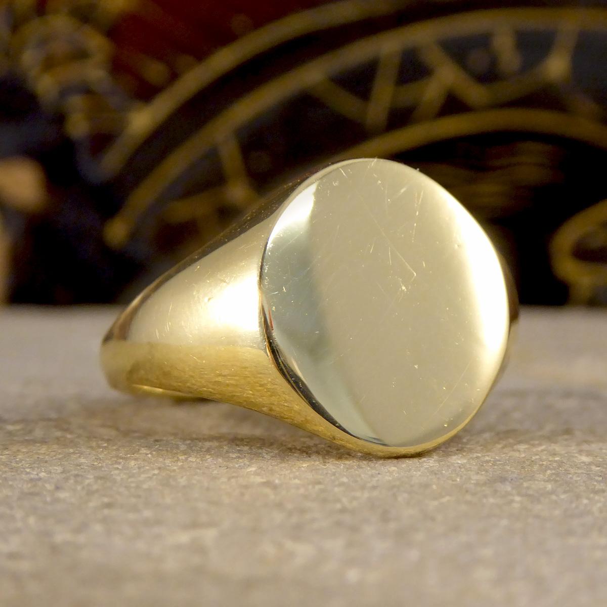 The signet ring is a classic and staple addition to any mans finger. It has become a universal unisex ring now and most commonly worn on the pinky finger. This ring was crafted from 18ct Yellow Gold with a plain circular face measuring 15mm by