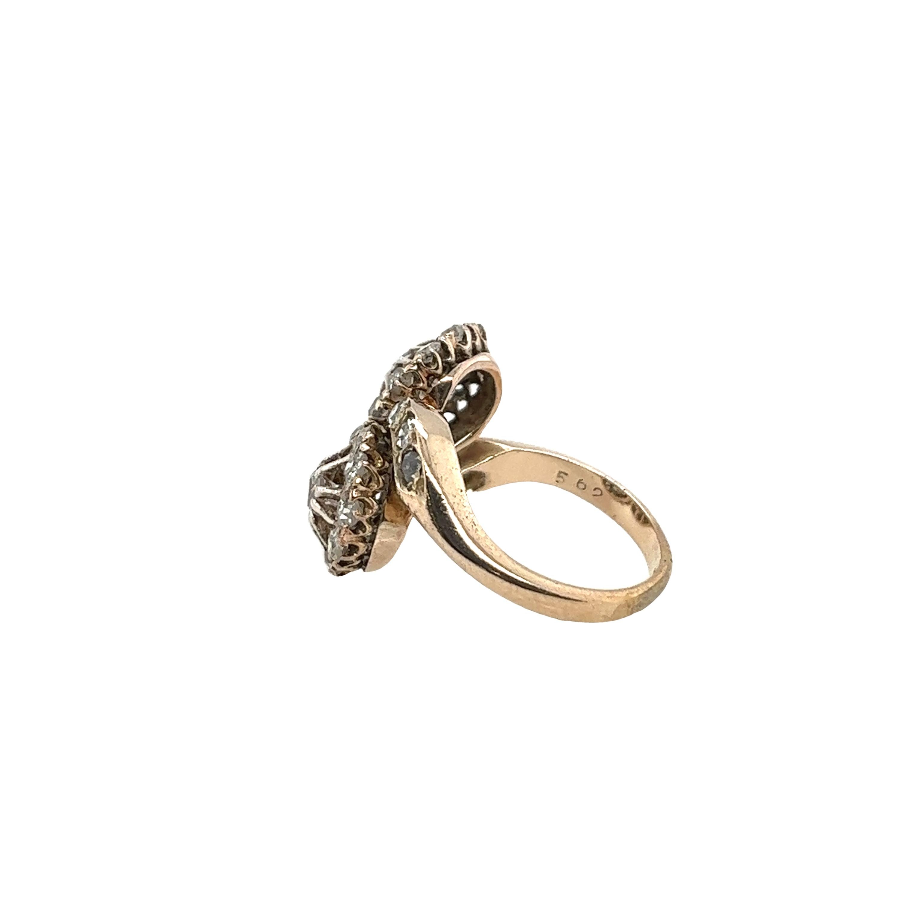 This vintage ring has a dazzling effect and is set in a cluster crossover setting in 14ct yellow gold with 0.70ct natural round old cut diamonds.
Total Diamond Weight: 0.70ct
Diamond Colour: L-M
Diamond Clarity: I
Width of Band: 2mm
Width of Head: