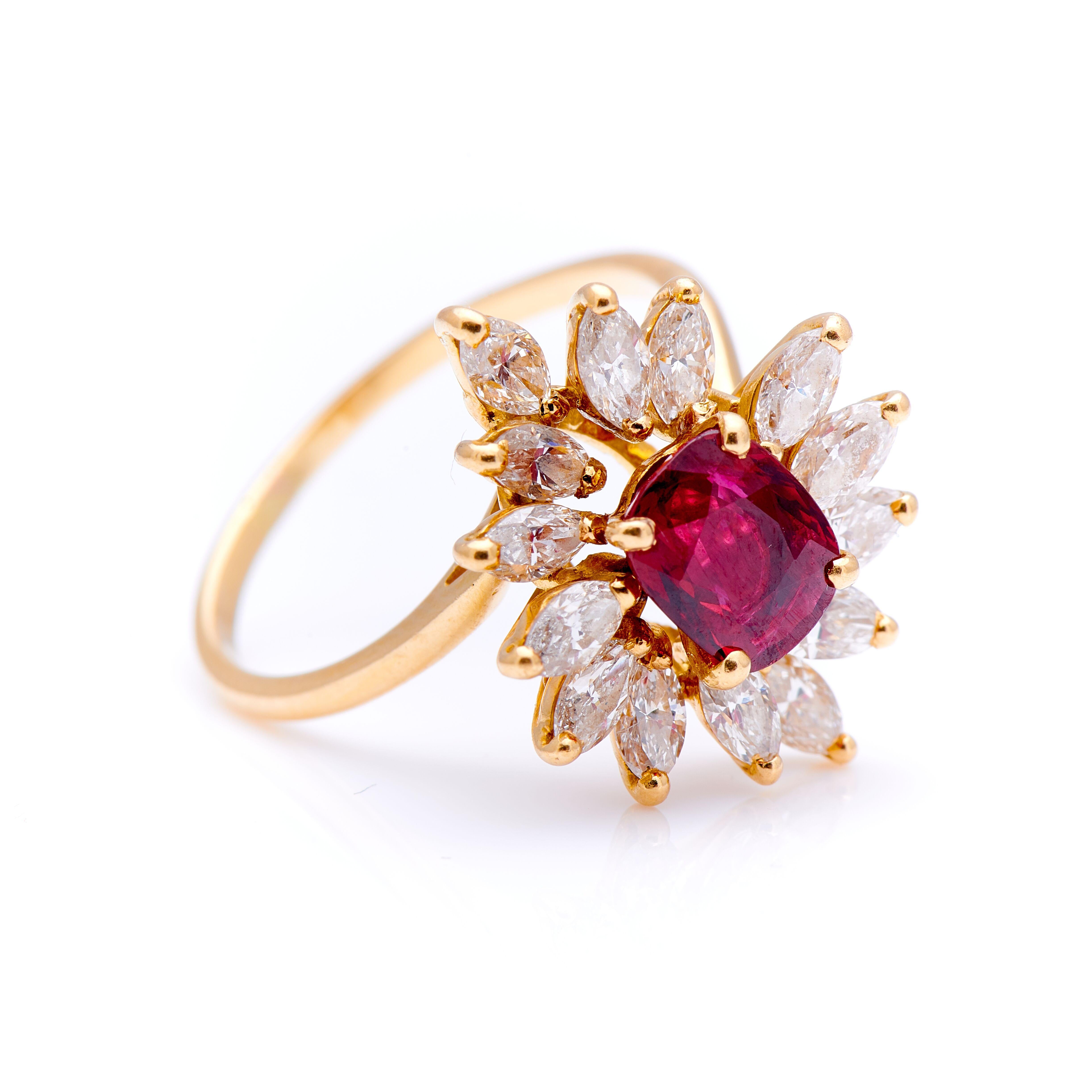 Vintage, ruby and diamond cluster ring, circa 1960. Set to centre a cushion-cut ruby of incredible colour, a pure vibrant red to slightly purplish red hue. Unusually, the ruby is a very clean stone, with no visible inclusions to the eye. And what’s