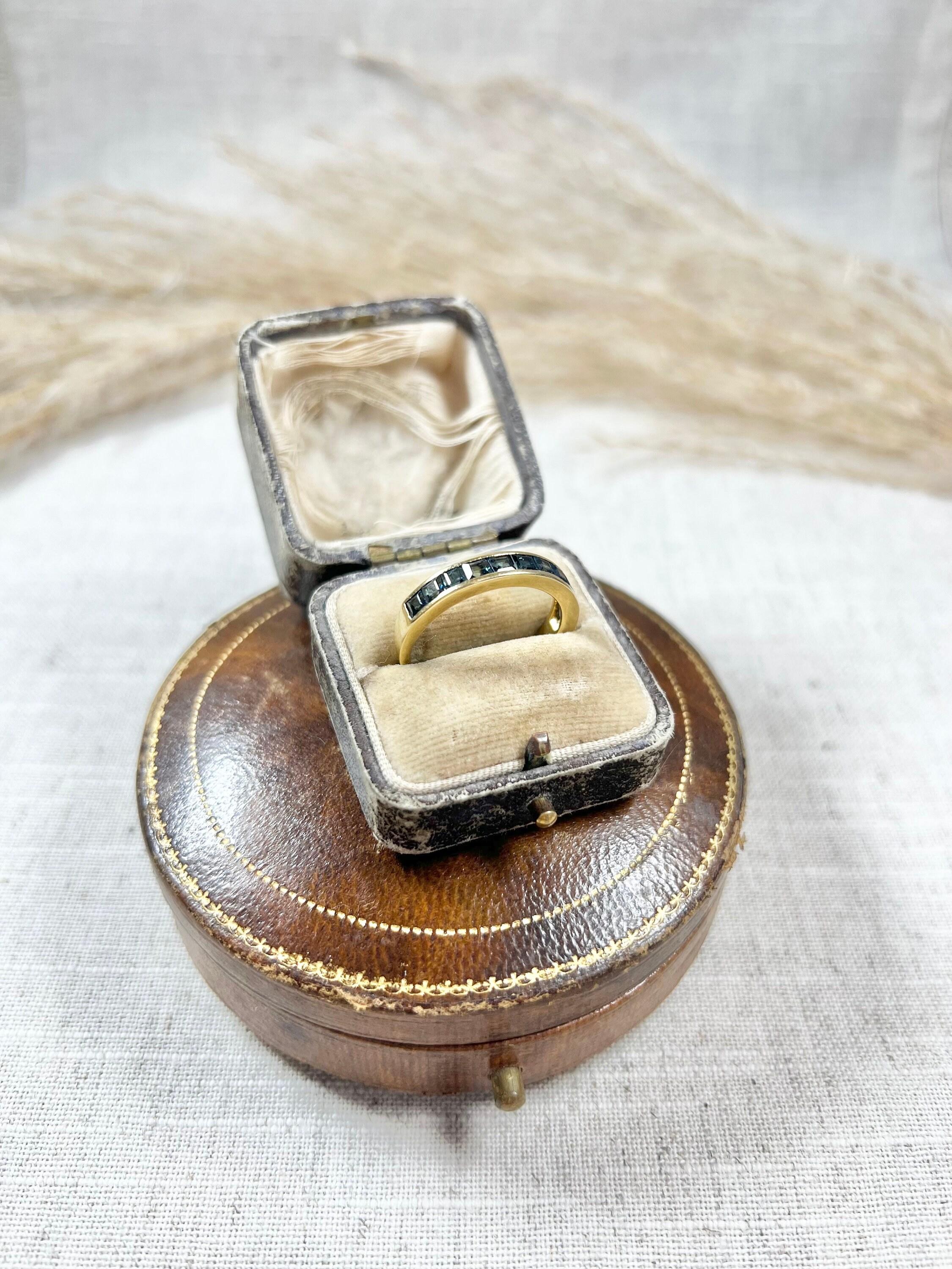 Vintage Sapphire Half Eternity Ring 

18ct Gold Stamped

Circa 1940s

This exquisite 18ct gold half-eternity ring is a true statement piece. Set with a stunning line of beautiful blue-calibrated natural sapphires, the ring exudes vintage glamour and