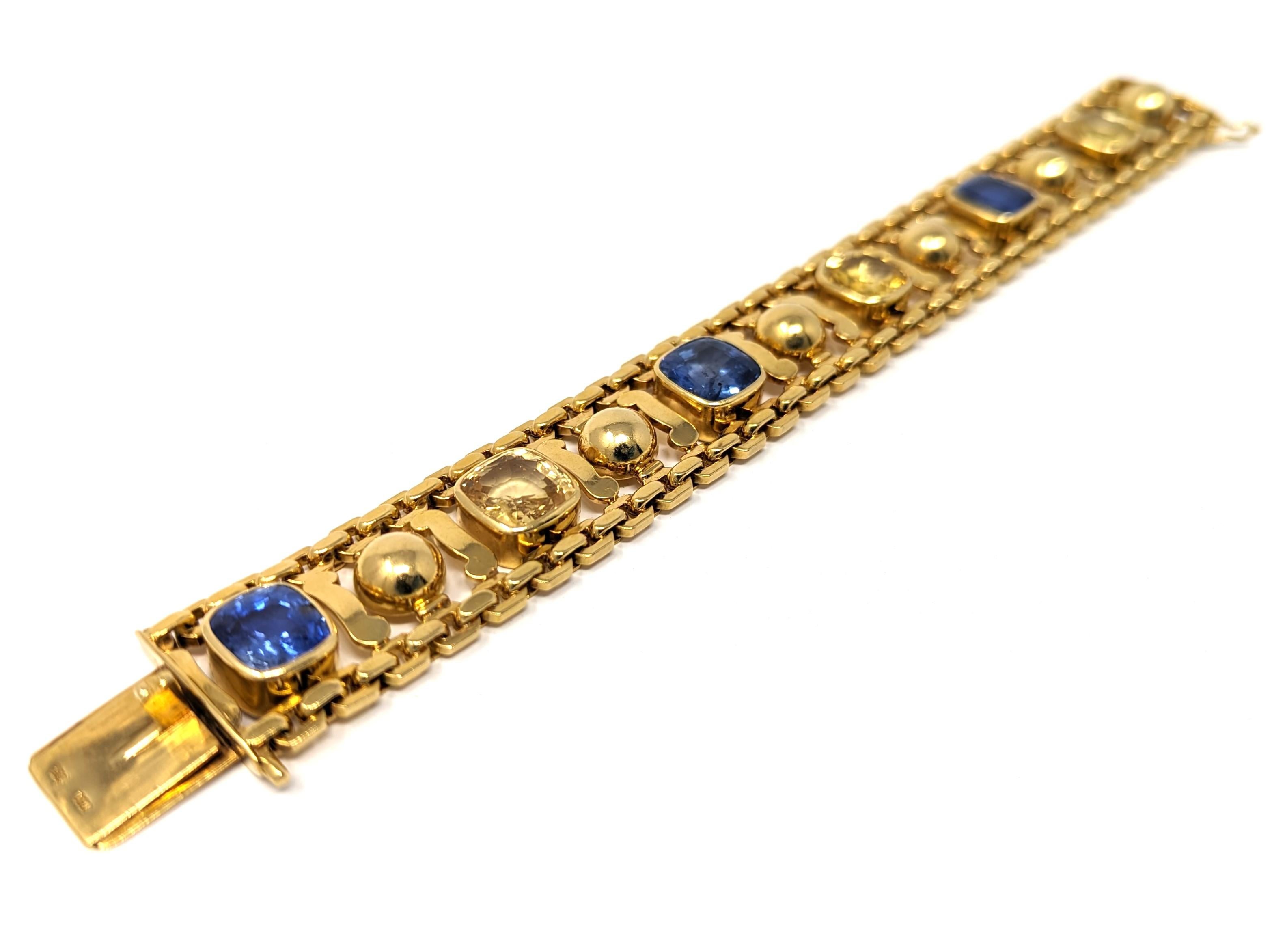 Lady's sapphire bracelet is made in 18 karat yellow gold, stamped 750, bears an abstract emblem / hallmark. Weighs 61.5 pennyweights. Cast and hand assembled construction, bright finish, workmanship shows good attention to detail, well finished,