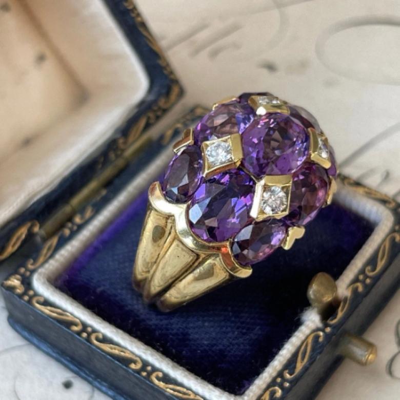 18k gold

Size: 5 3/4

Weight: 14.8 grams

Amethyst:  7.76 carats

Diamonds: .2 total carats VS2 clarity with H color

Markings: 750, KG in oval border