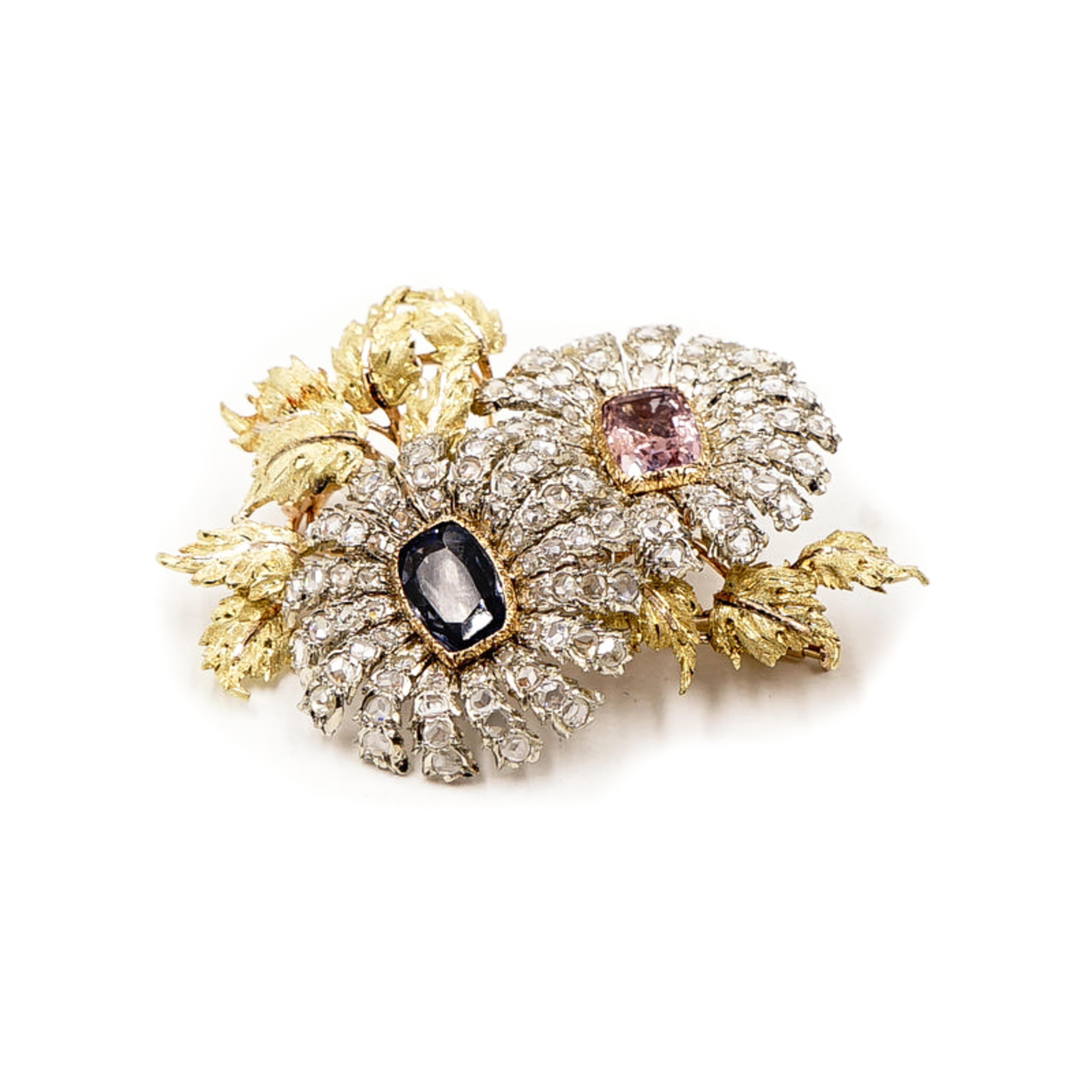 A delightful work of wearable Art by Buccellati. 
A pair of natural unheated Blue Sapphire and Soft Pink Sapphire centered the flowers, aglitter with rose-cut diamond-set in white gold petals, blossoming among textured leaves expertly handcrafted in
