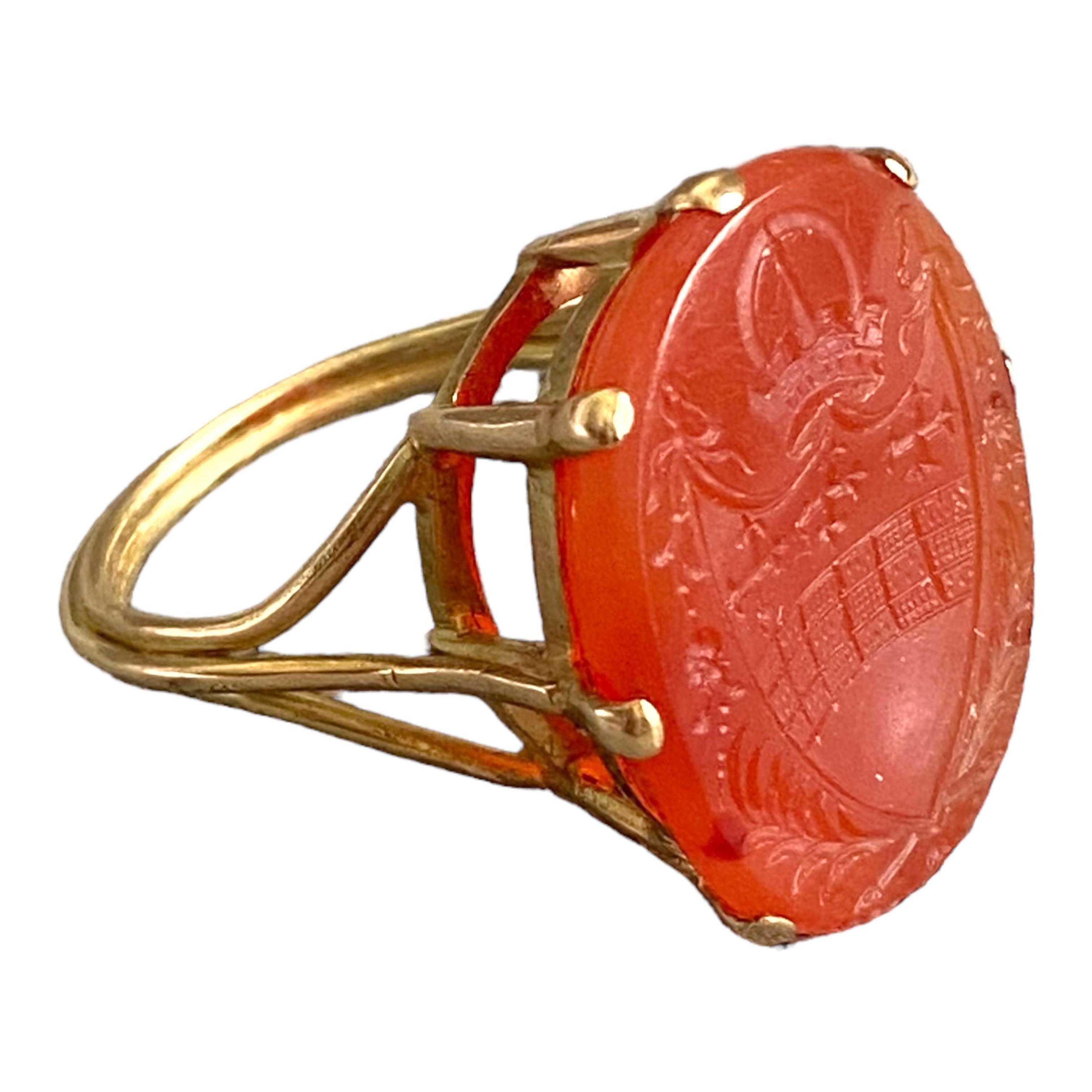 Crafted in 18K yellow gold, the ring features a large oval carnelian intaglio seal.
Measurements:
Front: 23.9 mm H x 20.6 mm W x 17 mm D
Band width: 2.3 mm
Size: 8 (sizable)
Weight: 9.4 grams
Marked: 750