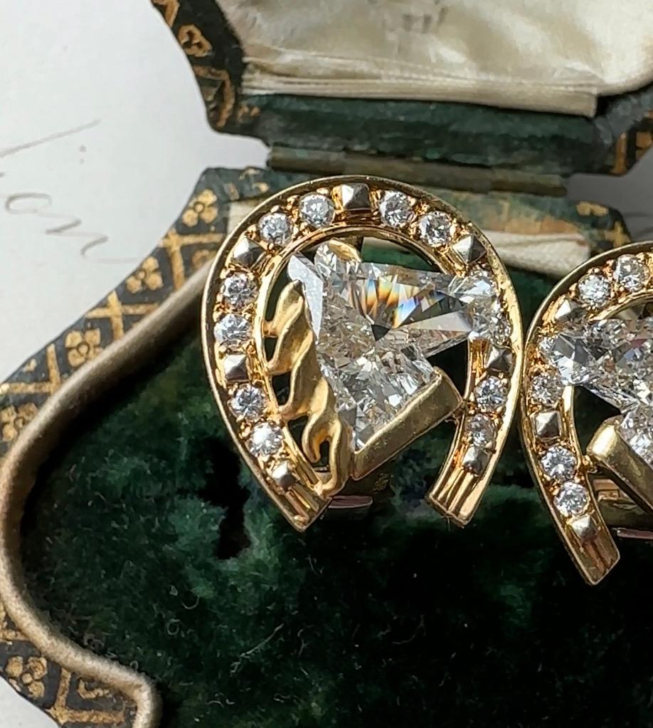 Designed by Carrera y Carrera of Madrid, Spain, crafted in gleaming 18k gold, these radiant equestrian earrings are a horse lover's dream come true. Each earring features a 1.2 carat bright icy-white horse-shaped diamond, framed by a glittering