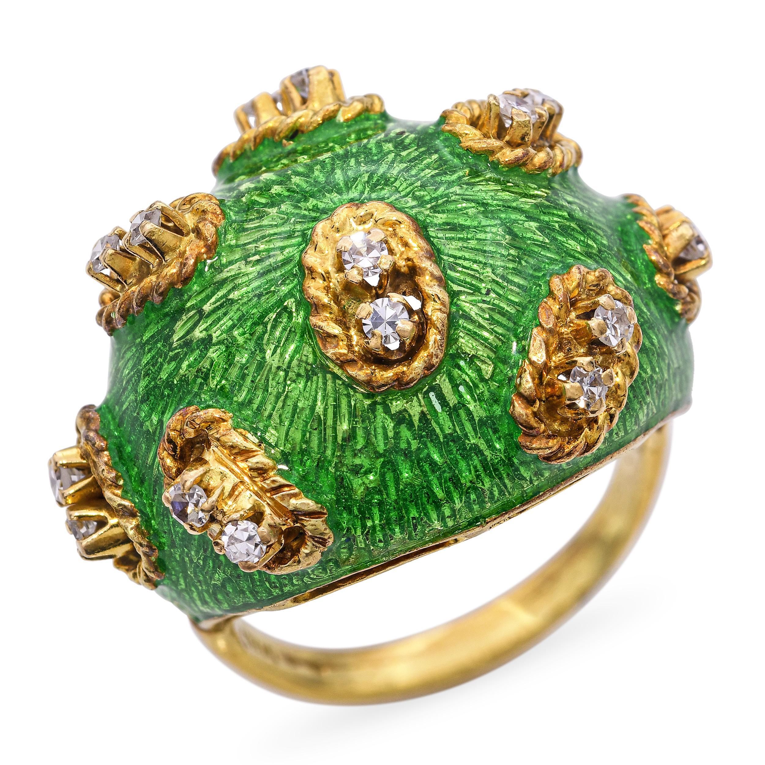 This vintage ring is crafted in 18k gold and features a bold dome-shaped design accented with intricate guilloché enamel work. Sparkling diamonds are delicately set within the enamel, adding brilliance and contrast to the rich, textured surface. The