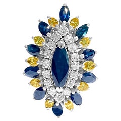 Bague vintage en diamants et saphirs bleus 18 carats et diamants jaunes