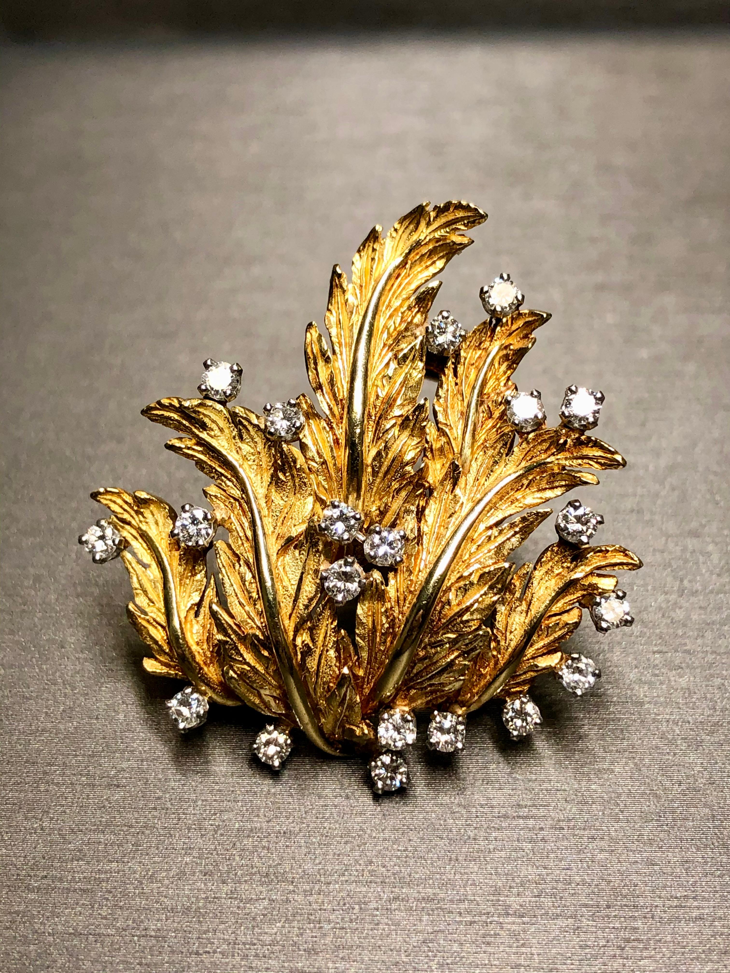 An elegantly designed brooch done in 18K yellow gold, prong set with approximately 1.20cttw in G-H color Vs1-2 clarity round prong set diamonds.


Dimensions/Weight:

Brooch measures 1.5” by 1.5” and weighs 22g.


Condition:

All stones are secure