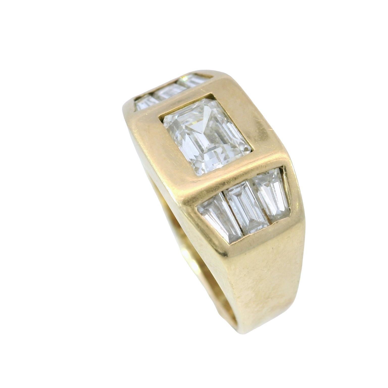 Emerald Cut Diamond and Baguette Diamond Ring 18k Gold Size 6

This bold ring features a central emerald-cut white diamond ~1ct, flanked by ~.72ctw baguette-cut white diamonds on either side. The geometric arrangement creates a sleek, modern