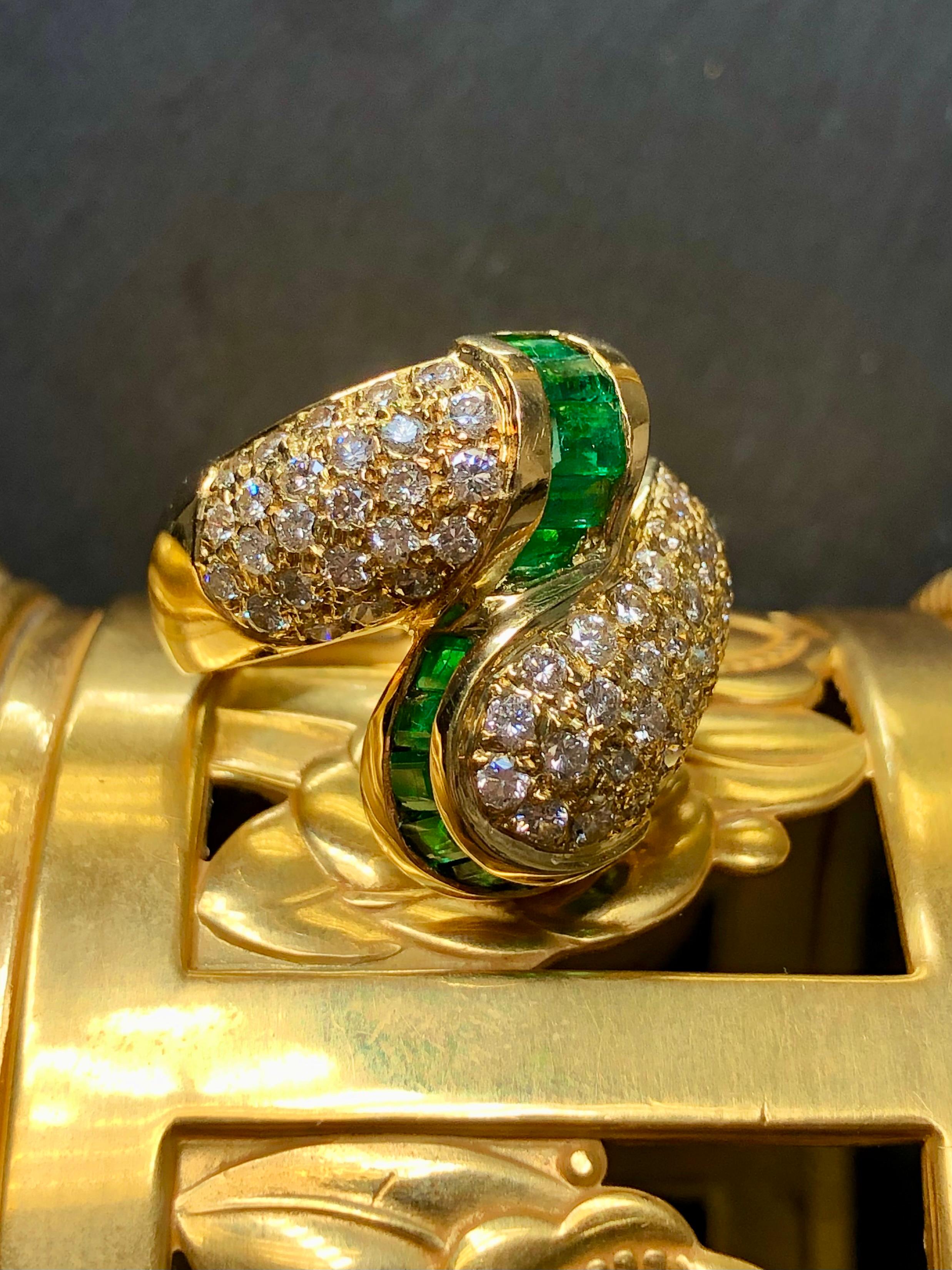 A gorgeous vintage bypass ring from one of the most bold periods in the jewelry world… c. the 1980’s - 1990’s. It is crafted in 18K yellow gold and pave set with approximately 2.20cttw in H-I color Vs2-Si1 clarity rounds diamonds and channel set