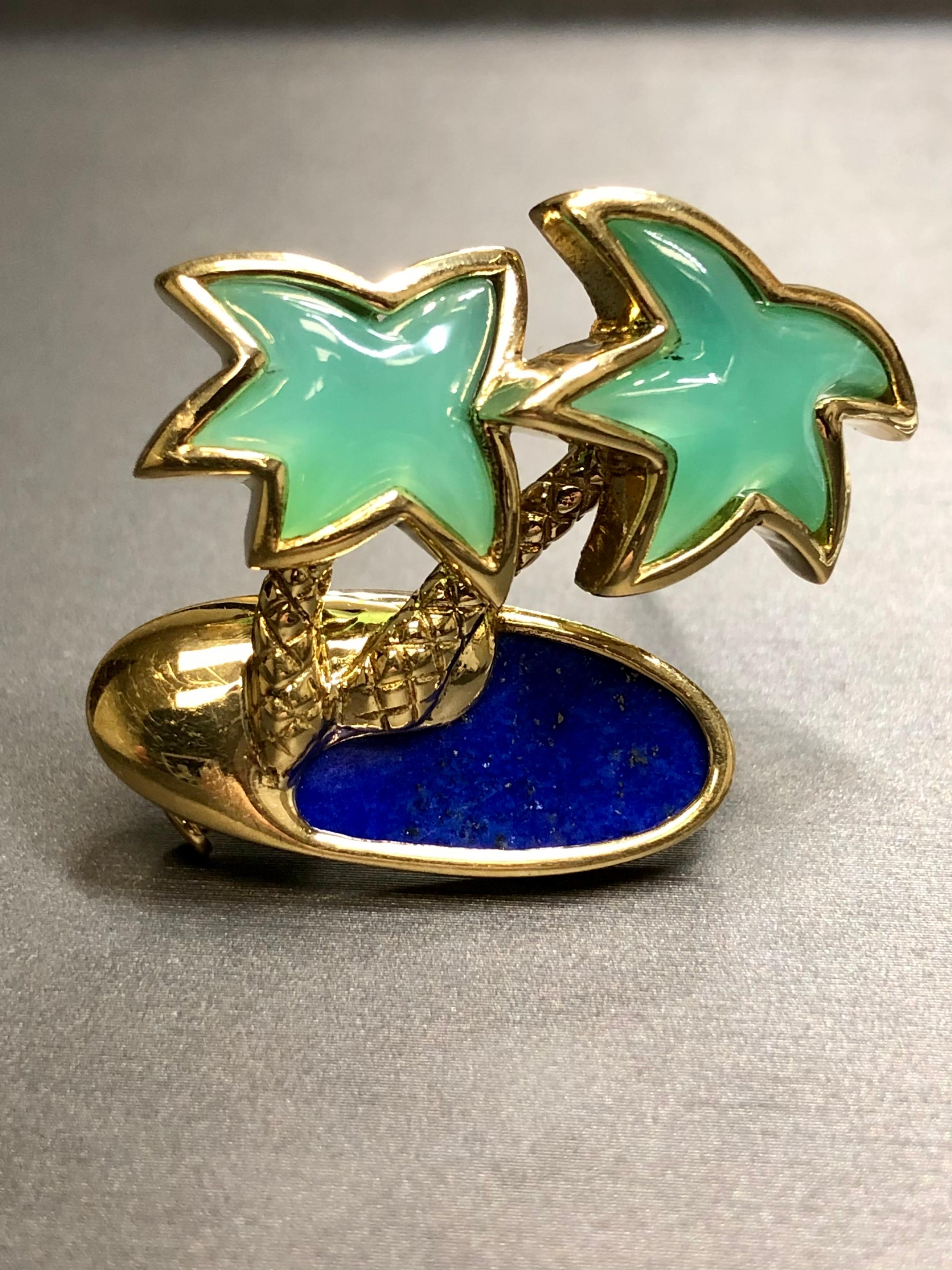 
A whimsical beach scene brooch by Fred of Paris handmade in 18K yellow gold and set with chrysoprase and lapis.


Dimensions/Weight:

Pin measures 1.25” tall by 1.40” wide and weighs 15.2g.


Condition:

Stones are secure and in good condition.