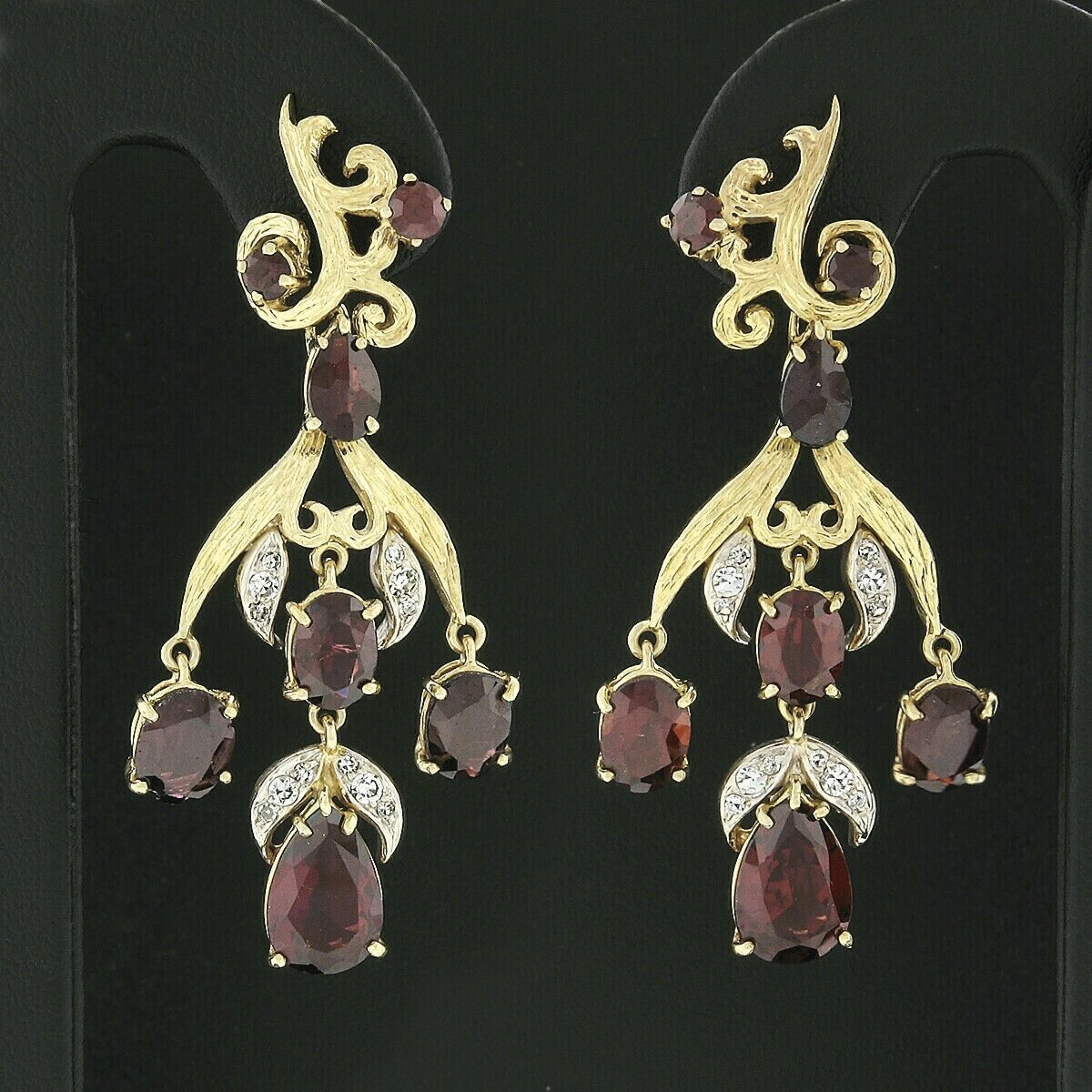 This gorgeous pair of pyrope garnet and diamond earrings was crafted from solid 18k yellow and white gold. These earrings features a pair of beautiful, prong set, pear modified brilliant cut pyrope garnets that has been certified by GIA. The 2