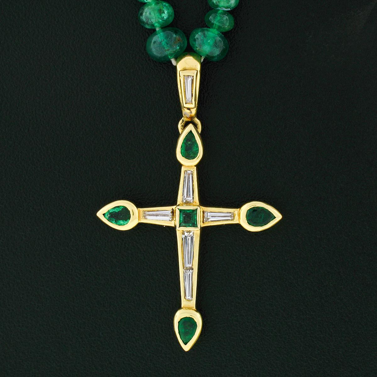 Here we have a beautiful vintage cross pendant crafted from solid 18k yellow gold hanging from a strand of GIA certified natural Emerald rondelle beads ranging from 2.30 to 4.41mm in diameter. One bead was selected at random for testing by GIA and