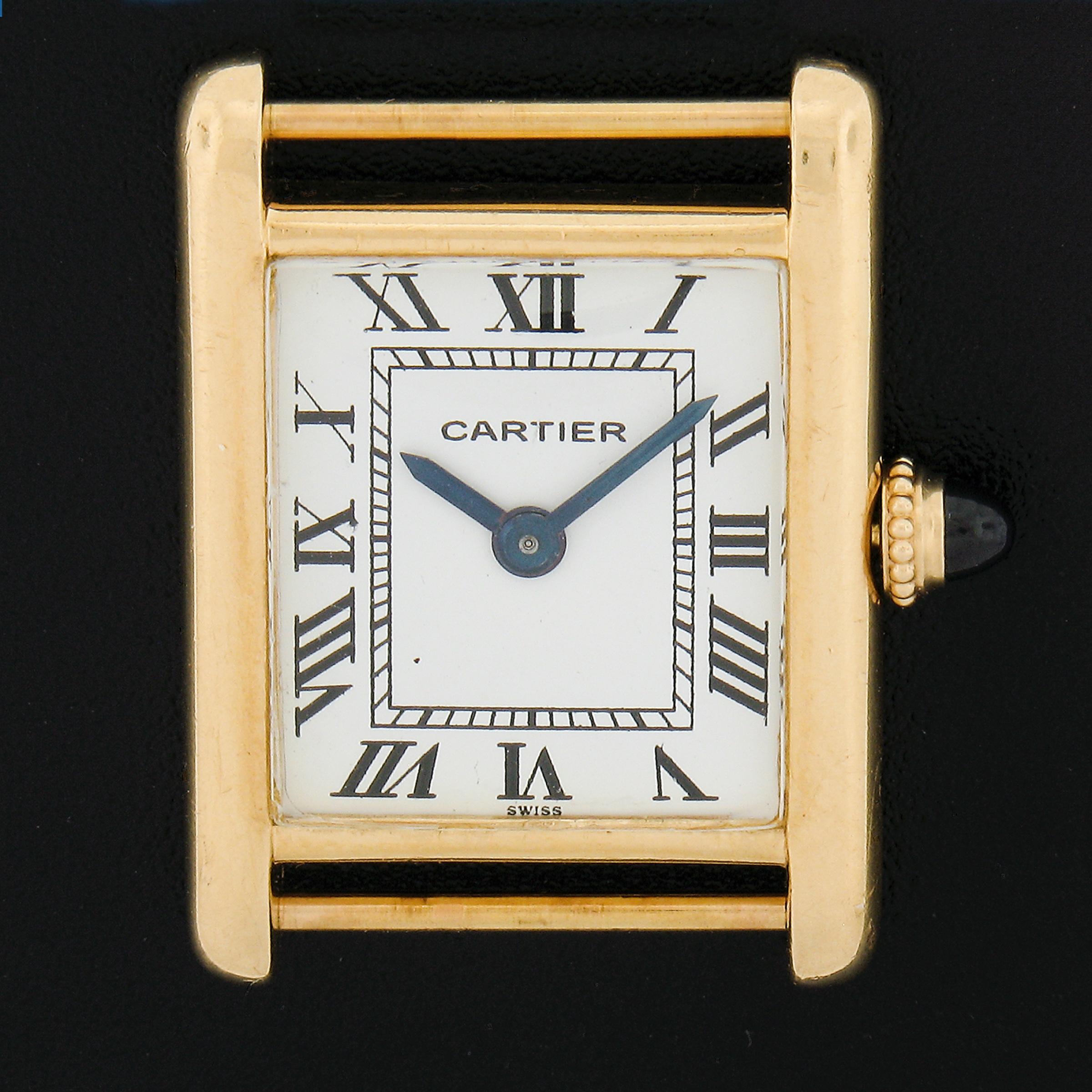 Here we have an authentic vintage Cartier Tank watch with a case crafted in solid 18k yellow gold as well as the deployant buckle. This watch features a Swiss-made, 20 jewels mechanical manually wound movement by Audemars Piguet that keeps accurate