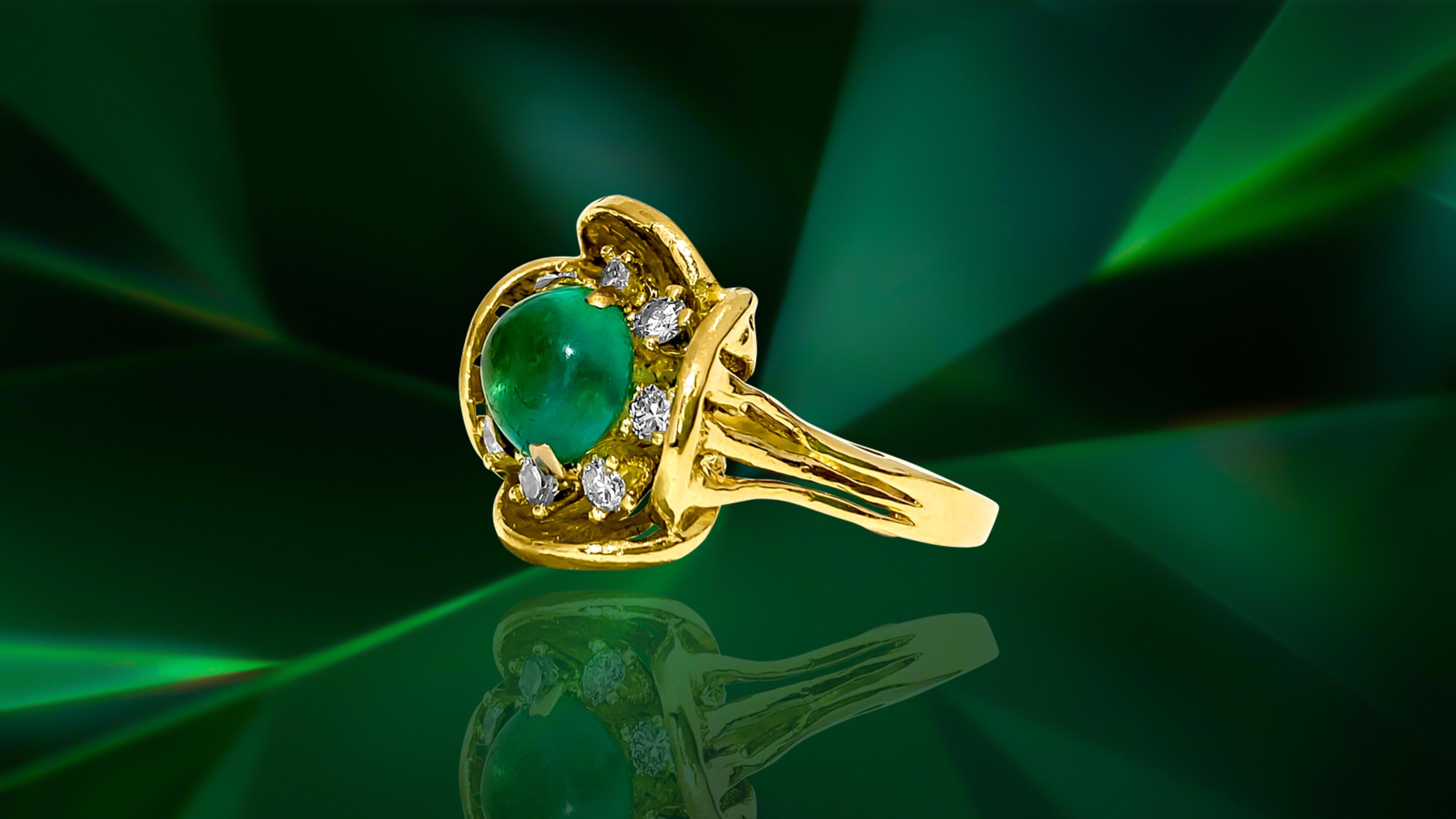 Crafted in 18K yellow gold, this vintage ring features a stunning 2.50 carat Colombian emerald in a cabochon cut, exuding timeless elegance. Adorned with 0.40 carats of G color diamonds with VS clarity, each stone is 100% natural earth mined and set