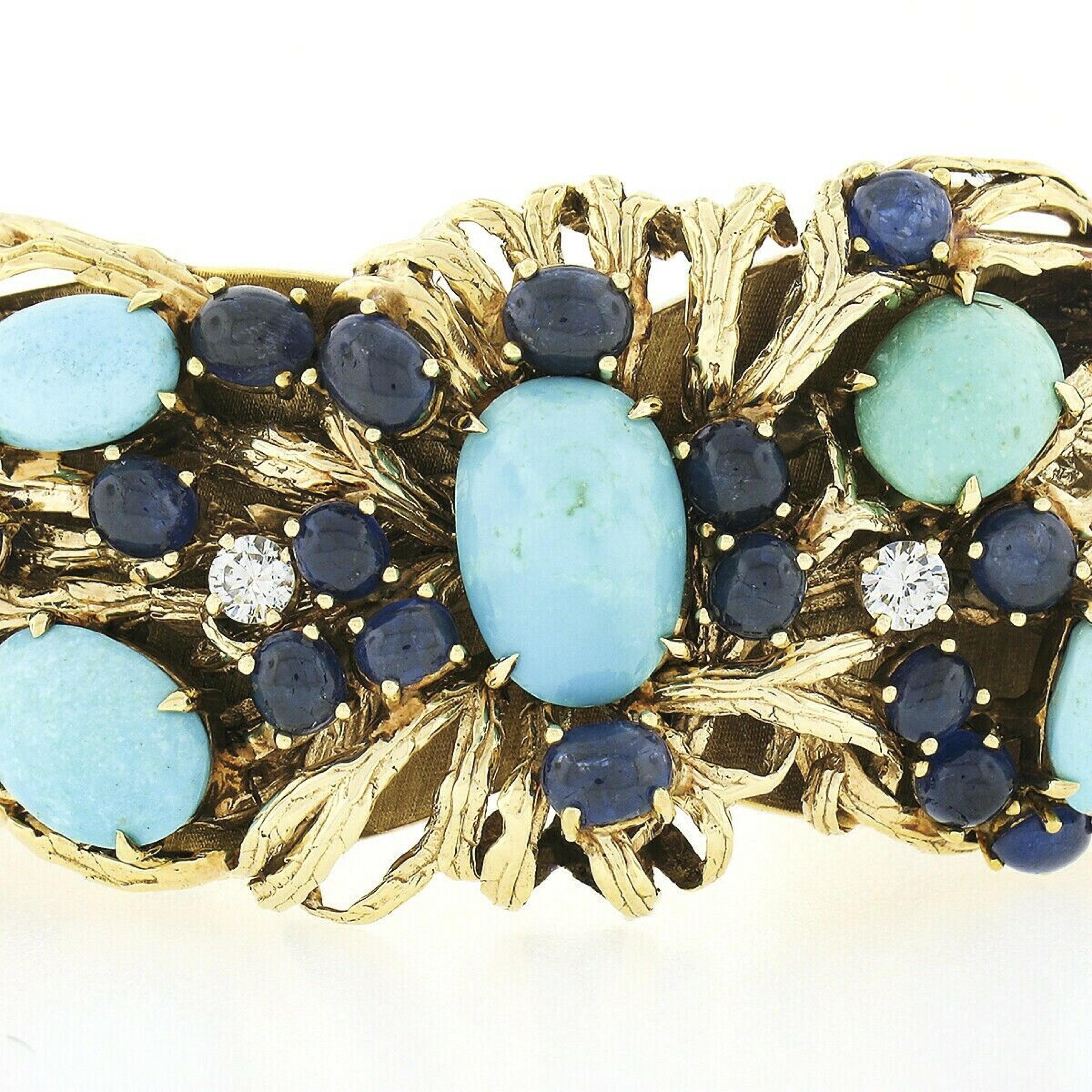 Here we have a very unique, wide, open cuff vintage bracelet crafted in solid 18k yellow gold. It features an incredible 3-dimensional textured leaf design that elegantly branches across its top carrying gorgeous turquoise, sapphires, and diamonds