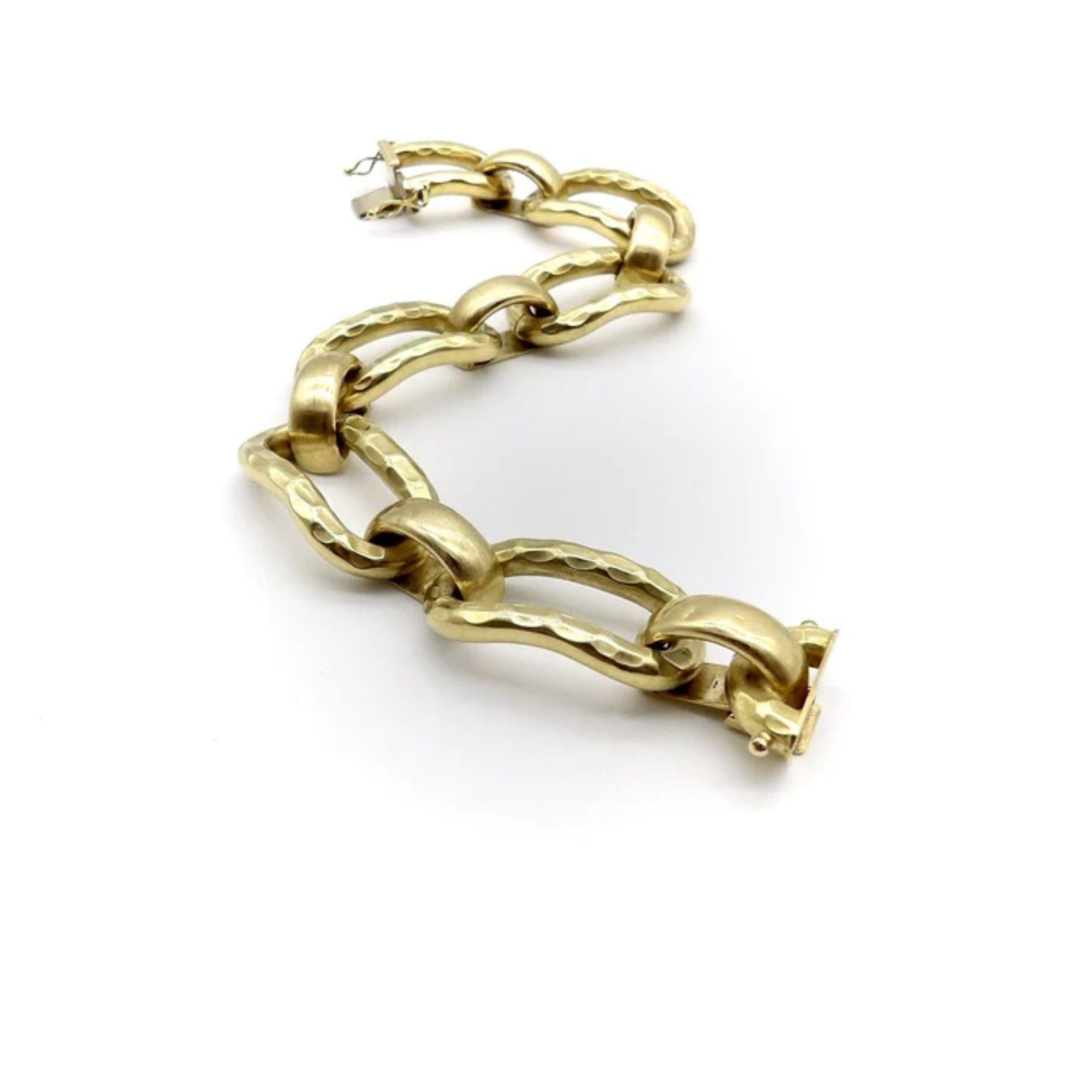 Circa 1970, this 18k vintage bracelet consists of alternating links that create a great, bold look. The bracelet’s pattern alternates between elongated links that are visually textured to emulate a hand-hammered surface, and shorter half-dome links