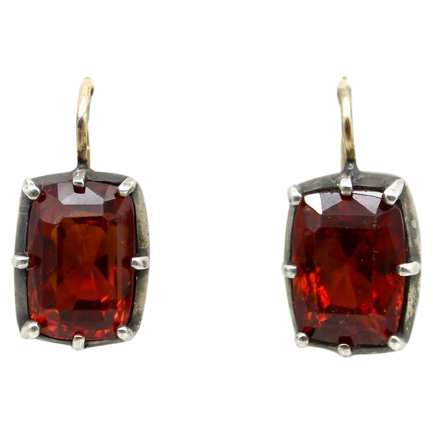 Orecchini d
epoca in oro e argento 18 carati con granato mandarino incastonato in vendita