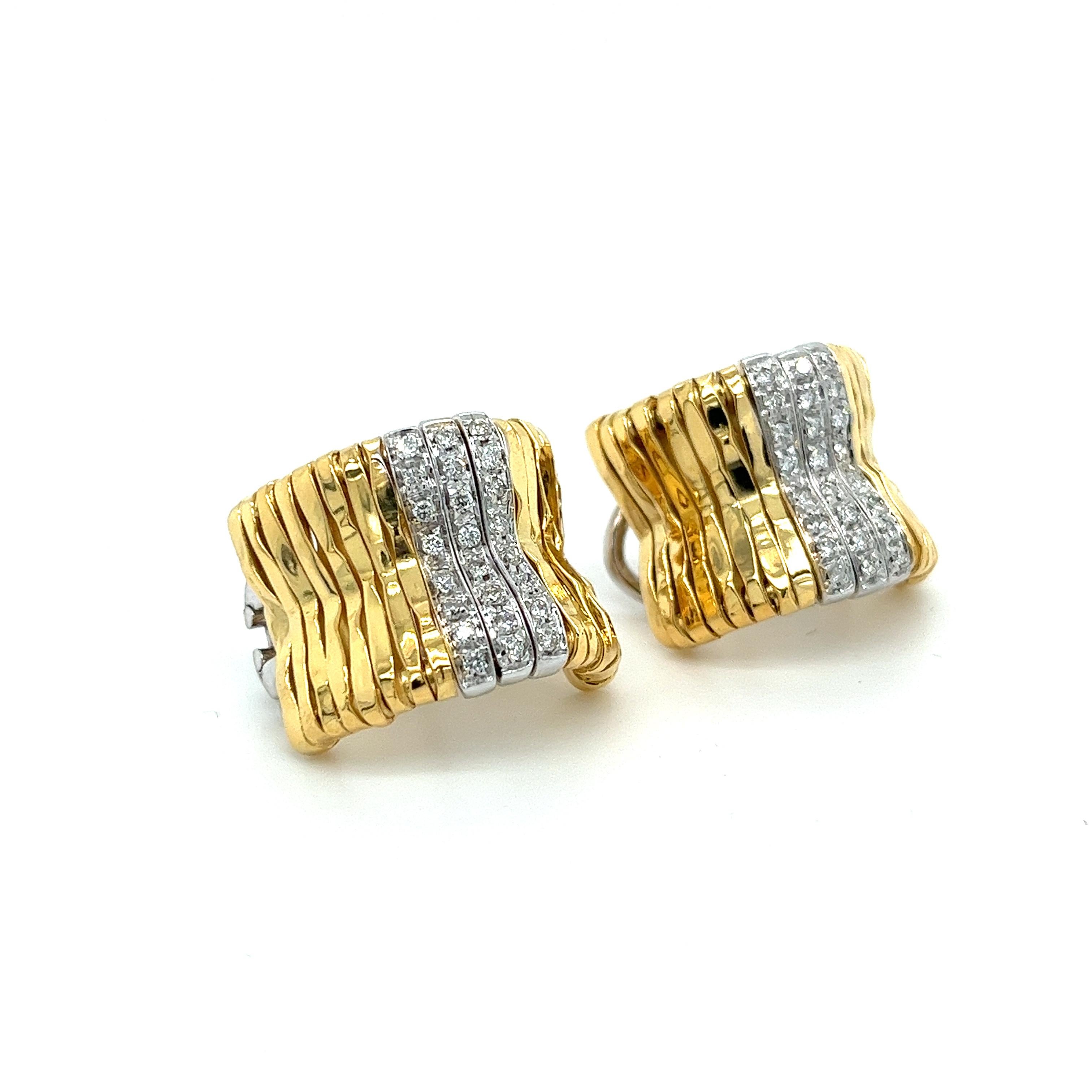 Orlando Orlandini signed handmade 18K yellow gold ribbed bar style hug hoops with 3 rows of white gold pave set round cut diamonds. These vintage earrings feature 48 brilliant cut diamonds approximately of 0.50 carats total. Mountings have