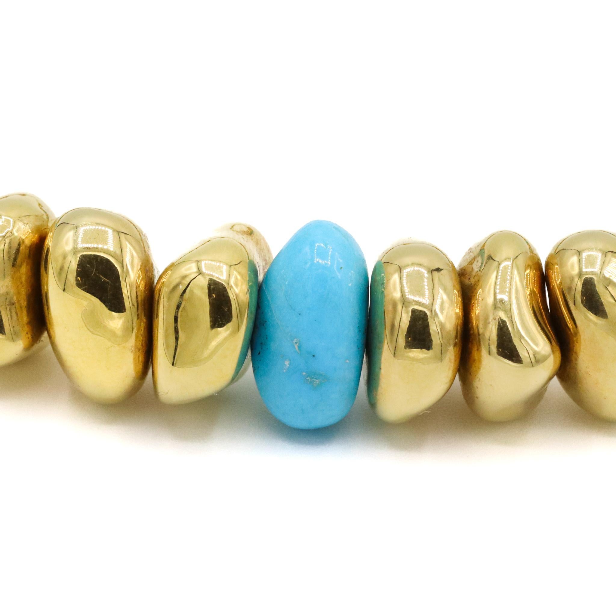 One lady's hand made polished 18K yellow gold choker, turquoise bead necklace. The necklace measures approximately 17.00 inches in length by 13.07mm tapering to 11.51mm in width and weighs a total of 68.30 grams. Engraved with 