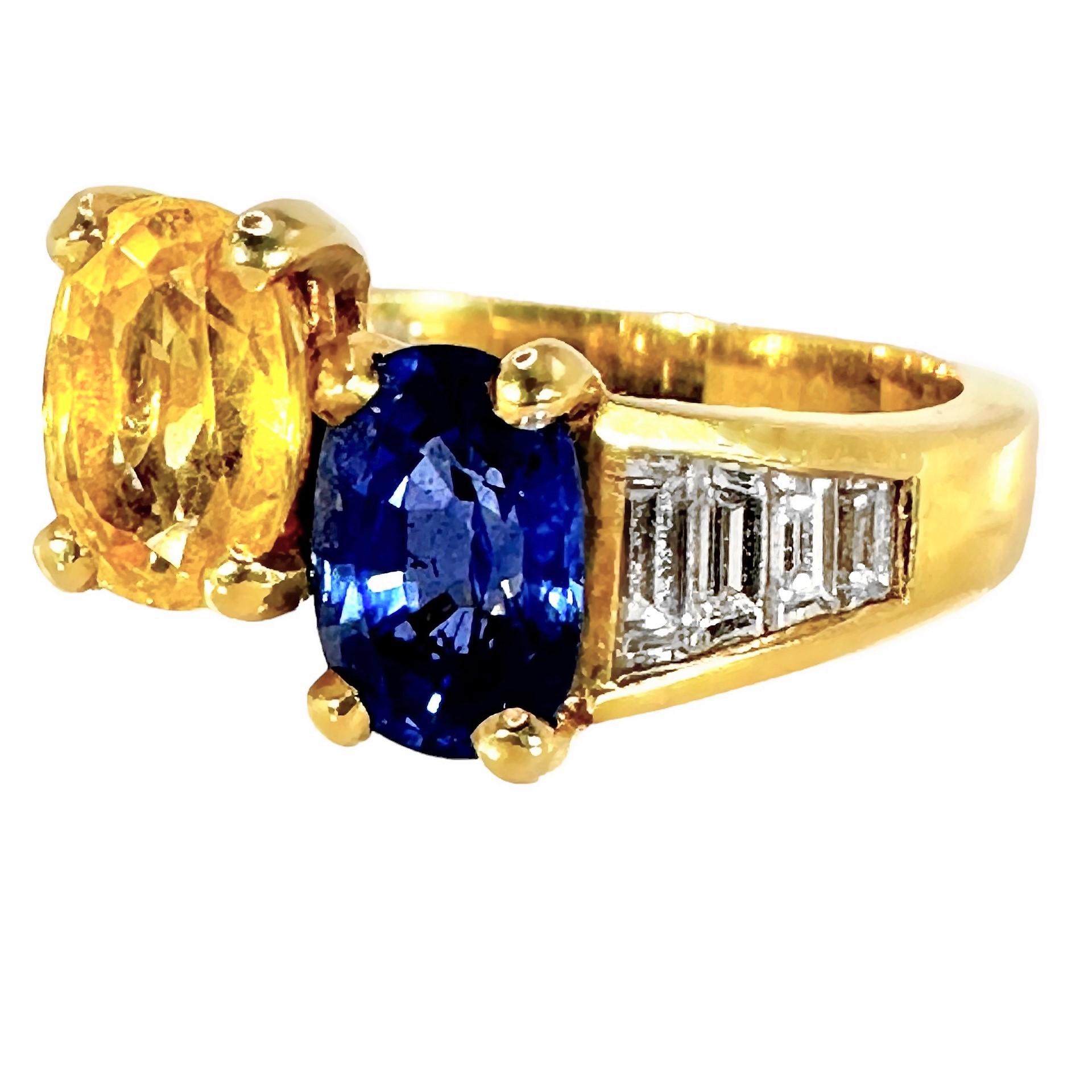 This tailored, smaller scale, 18k yellow gold vintage Julius Cohen sapphire and diamond offset ring is truly a mid-20th Century treasure. It is prong set with one oval shaped, brilliant natural blue sapphire and one oval shaped, brilliant natural