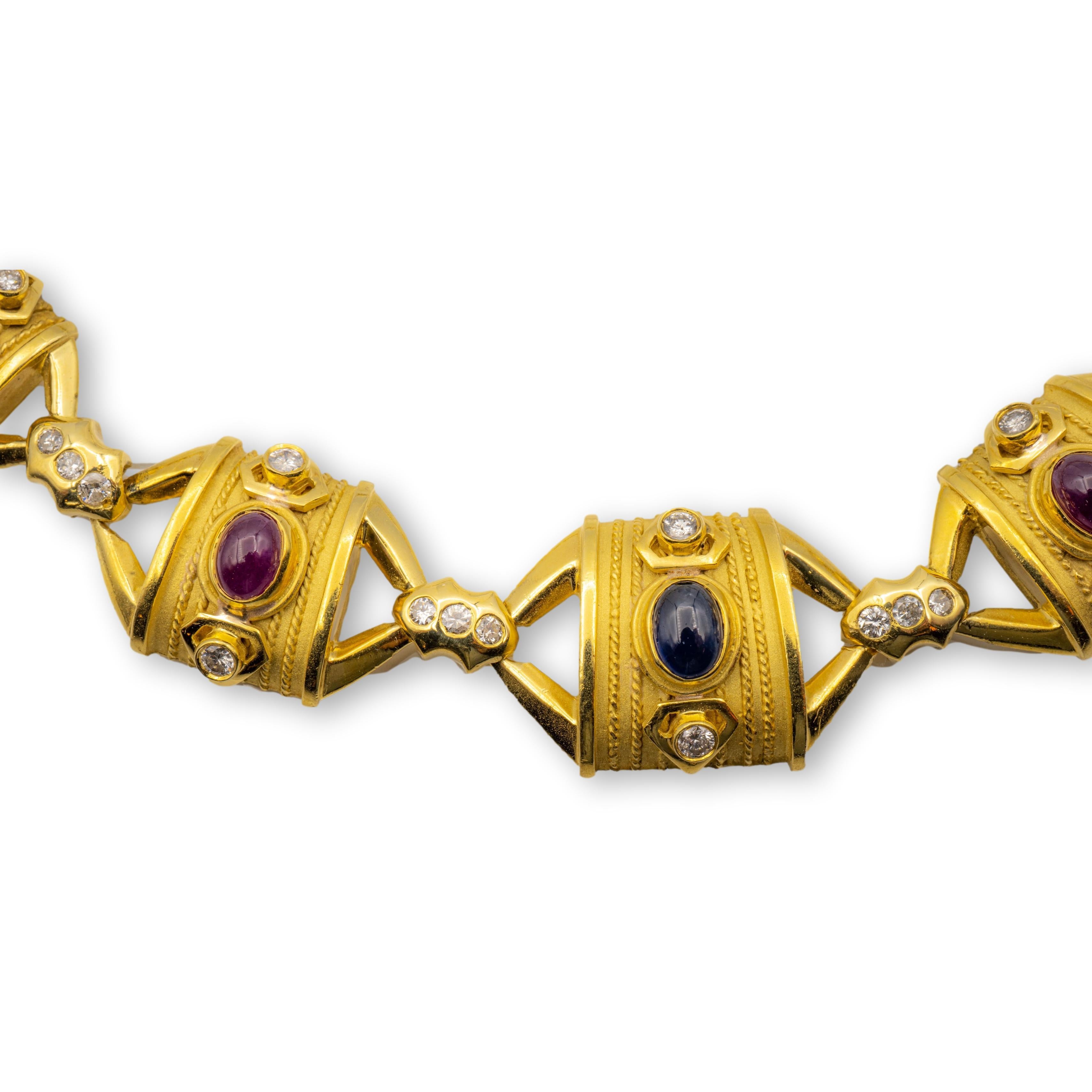 Vintage choker necklace finely crafted in 18 Karat yellow gold featuring cabochon Rubies , sapphires and emeralds and burnished set round brilliant cut diamonds weighing 2.70 carats total weight approximately. This necklace was handmade and has a
