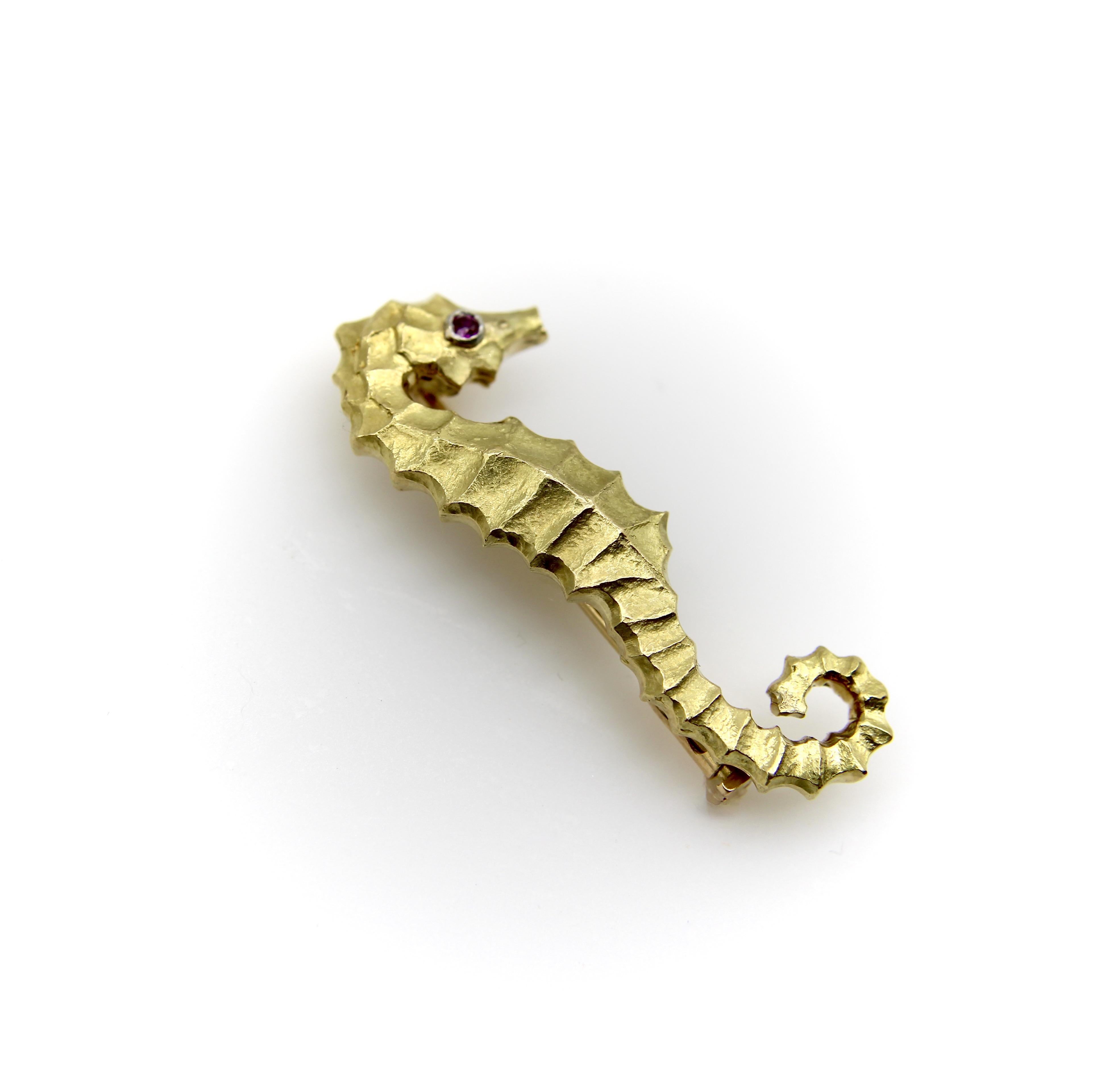 In the 1970’s, several design houses were flirting with their versions of a seahorse brooch. This version is done by Cartier, though you can find versions done by Tiffany & Co. and David Webb using the popular motif around the same time. What we