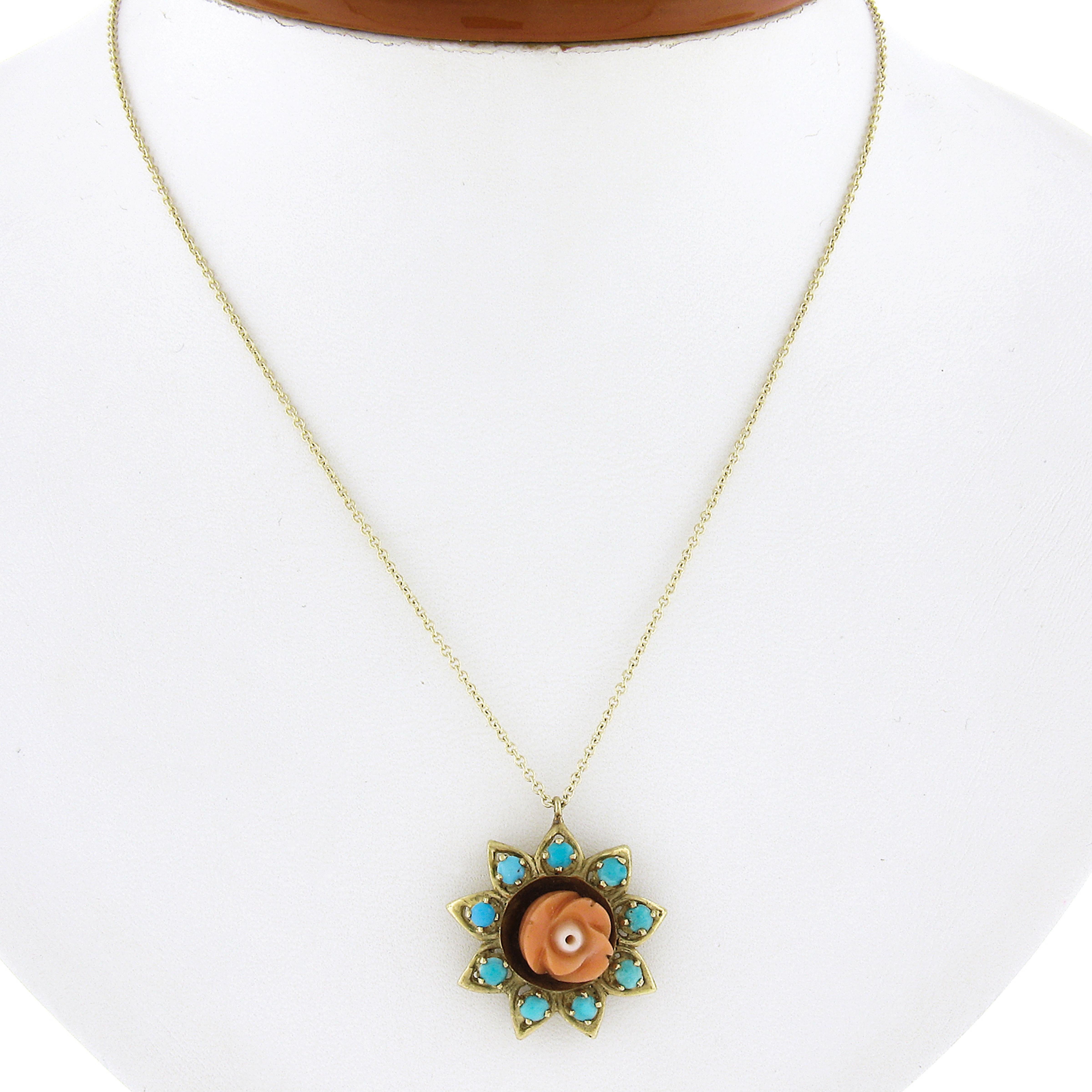 Here we have a gorgeous vintage flower pendant necklace crafted from solid 18k yellow gold featuring a carved coral rose flower. The coral shows a wonderful rich orange color throughout. The rose coral is surrounded with a 9 bead turquoises and
