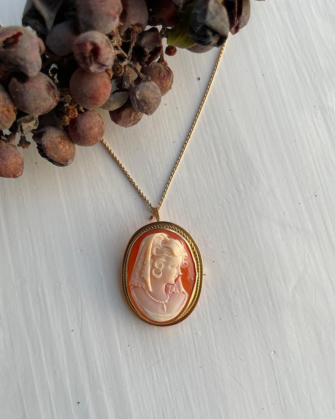 There is something so magical to me about vintage and antique cameos: the way the portraits are rendered in such incredible detail seems to tell a person's mystery. This cameo is carved from genuine shell with such impressive precision, and it's set