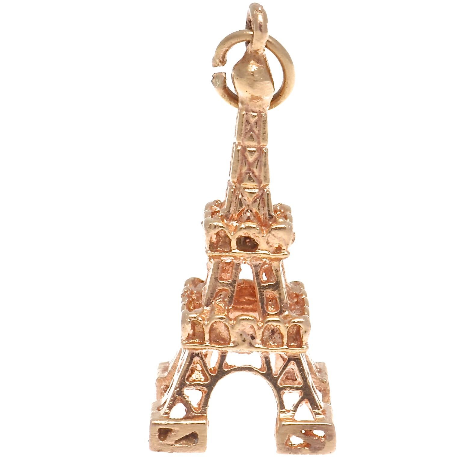 Buy one or all of these delightful vintage 18K gold charms. 
1960s vintage 18k Gold Eiffel Tower Charm. 4.6 grams. 1-1/8 inches x 1/2 inch. 18k $950
1950s vintage 18k Gold Car Charm. 7.4 grams. 1 inch x 1/2 inch. 18K. $1000
1950s vintage 18k Gold