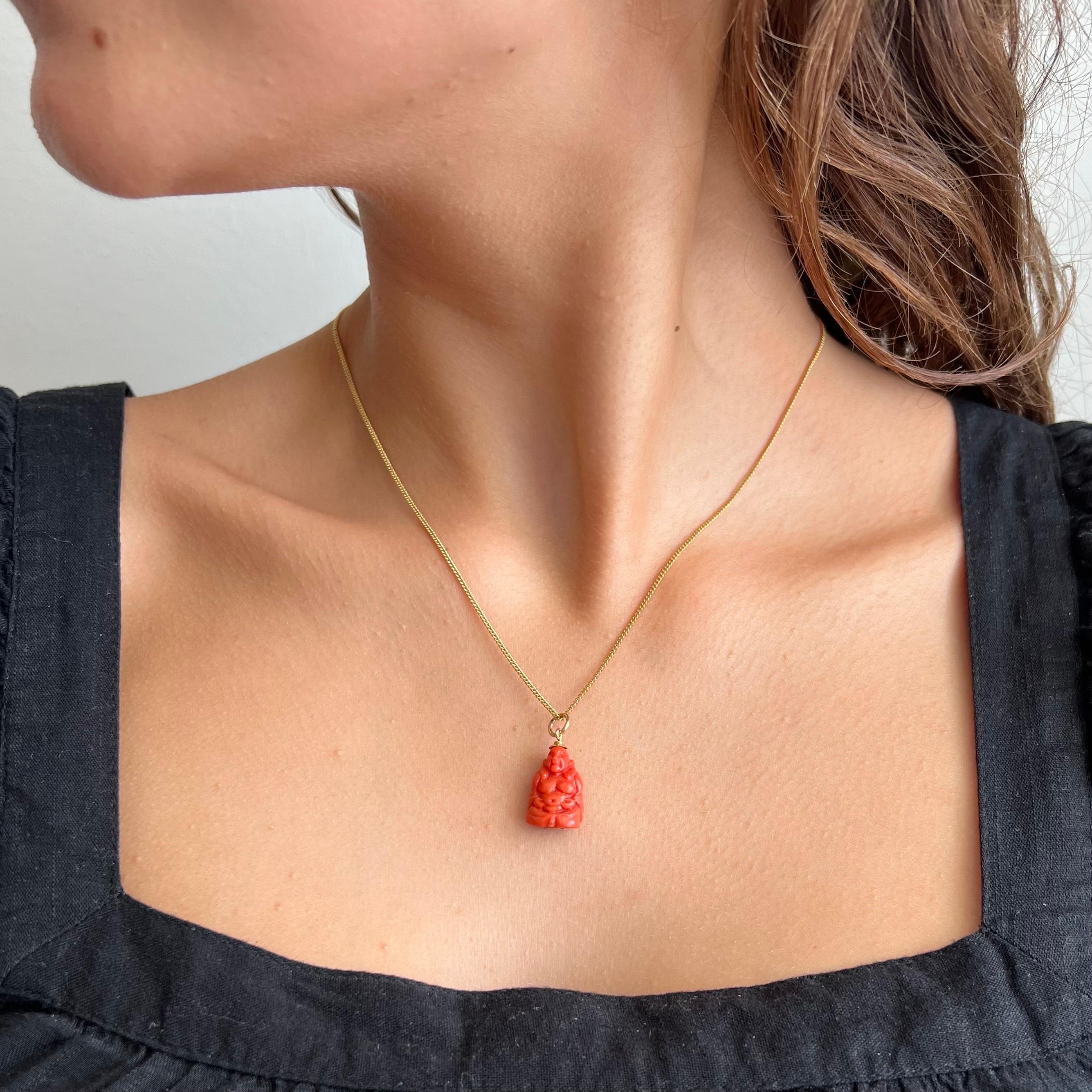 A charming carved coral sitting buddha charm pendant. This vintage coral buddha charm pendant is beautifully detailed. The lovely sitting buddha is created with an 18 karat gold bail and rosette at the bottom.

Collect your own charms as wearable
