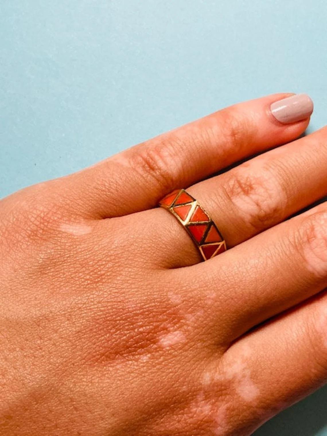 Vintage 18k Gold Coral Zig-Zag Ring Limited Edition, Size O UK/AU

This cool, vintage ring made of coral and 18k yellow gold is the perfect accompaniment to any look. It's geometric, mosaic-style pattern adds a splash of colour and is the ideal