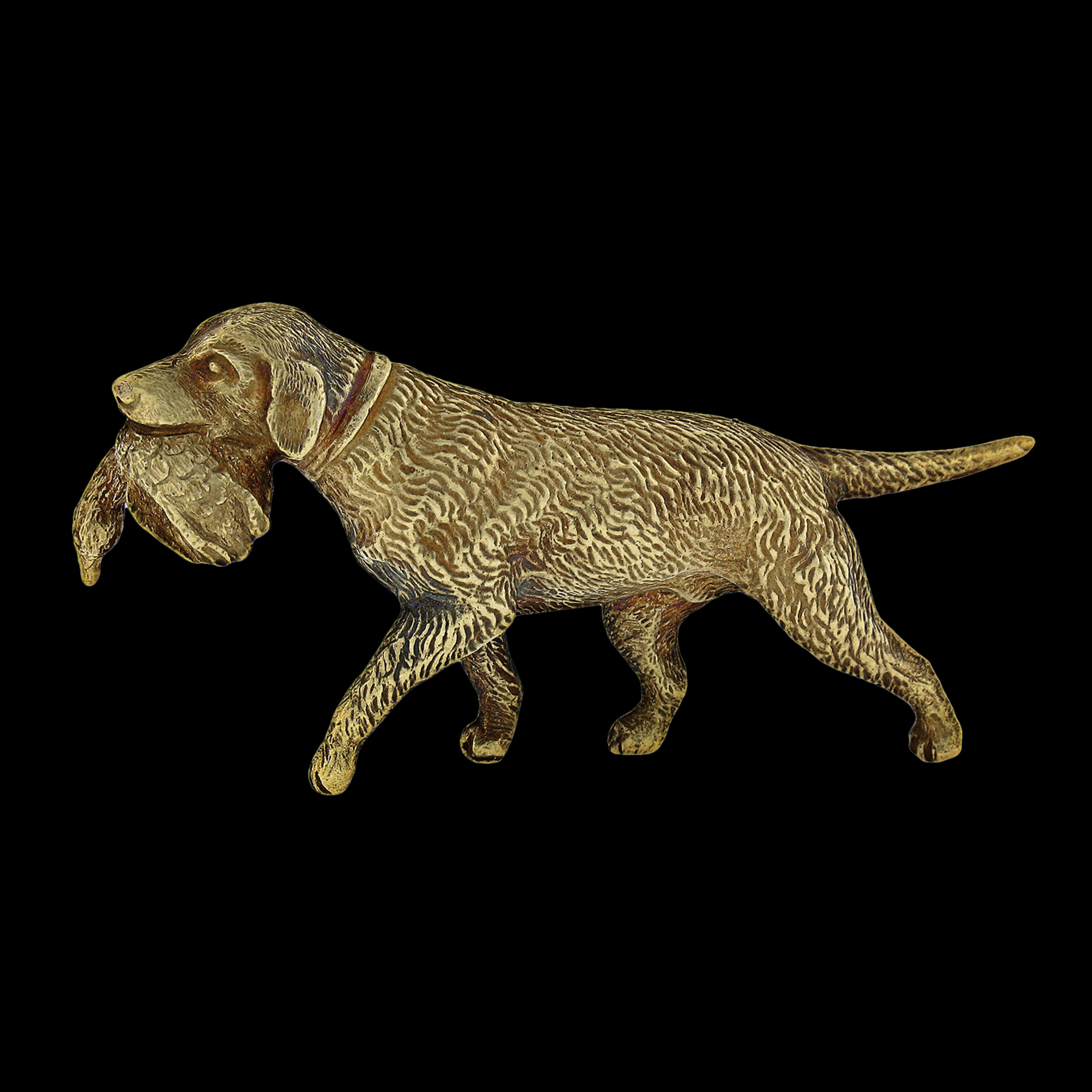 This incredible and very well made vintage pin/brooch is crafted in solid 18k yellow gold. It features a perfectly structured Chesapeake Bay Retriever dog design with a duck in its mouth, showing remarkably outstanding workmanship and texture that