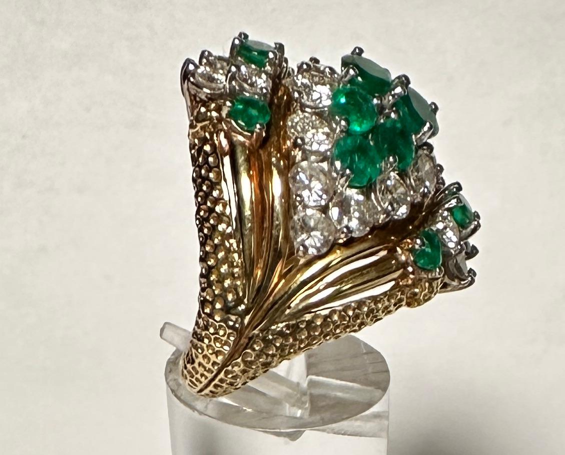 Beautiful 18K yellow gold, diamond and emerald cocktail ring.
Approx. 2.25cts diamond weight. 
H-I color. 
VS-2 Clarity.
Size 7 1/4.
Marked 18K