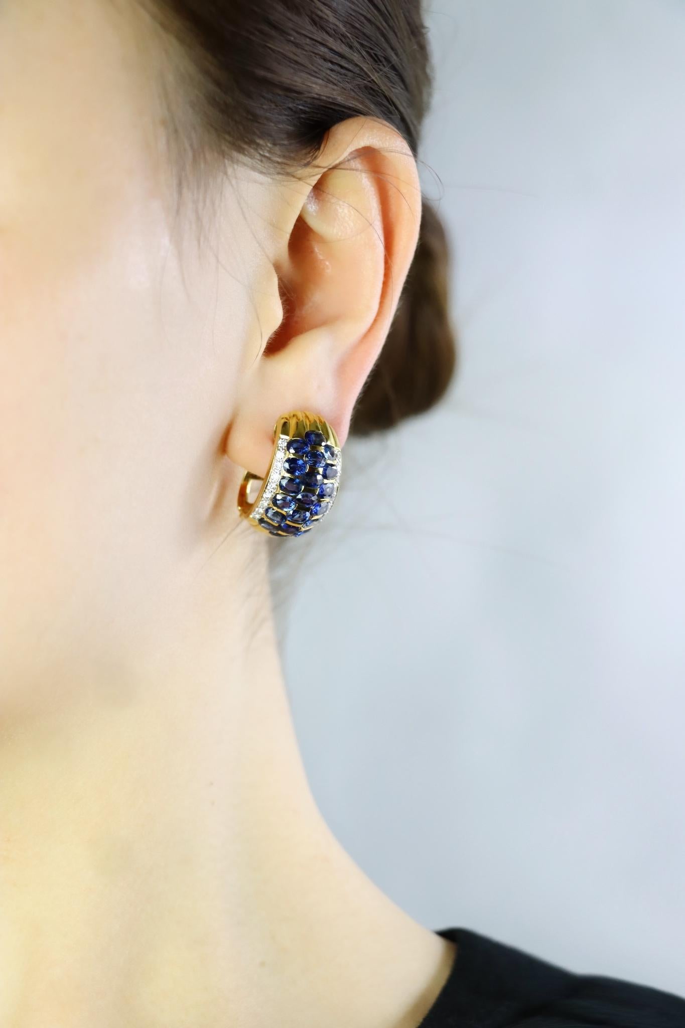 Vintage 18K Gold Diamond and Sapphire Huggie Earrings 
Featuring approximately 7+ Carats of Oval Brilliant Sapphires and 1 Carat of Diamonds

Approximate Dimensions:
2.5 cm (Length) 
1.7 cm (Width) 
21.6 grams in weight.

** All dimensions listed