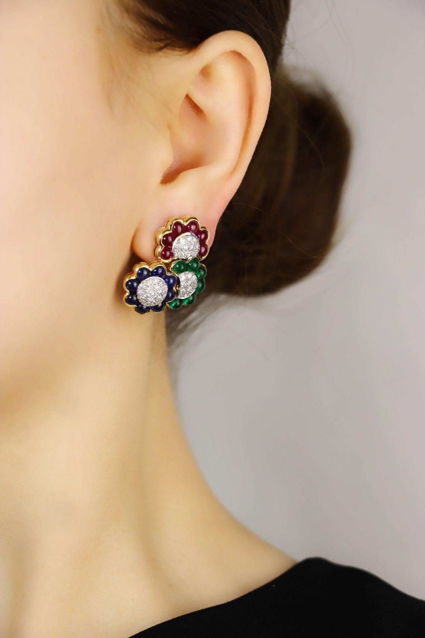 Vintage 18K Gold Diamond Ruby Sapphire Emerald Earrings

Marked:
750

Approximate Dimensions:
3 cm (Length) 
2.5 cm (Width)
Approx. 1.6 carats (Diamonds)
Approx. 8 carats (Sapphire)
Approx. 7.68 carats (Ruby)
6.06 mm x 5.52 mm (Surface Dimensions of