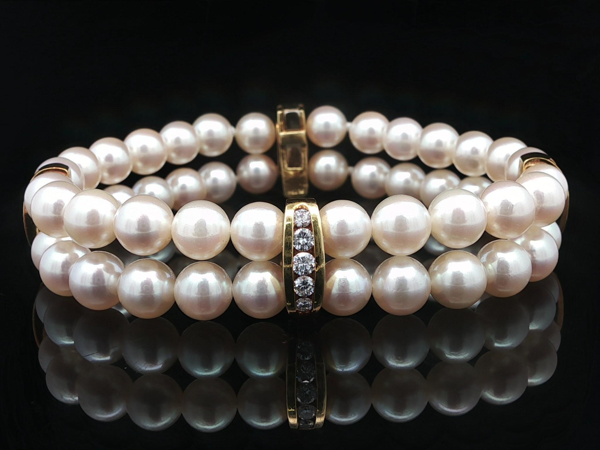 --Stone(s):--
(52) Genuine Culture Pearls - Round Bead Shape - White Color w/ Pink Overtone - Excellent Luster -6.6-7mm each (approx.)
(20) Natural Genuine Diamonds- Round Brilliant Cut - Channel Set - F/G Color - VS1/VS2 Clarity - 0.84ctw