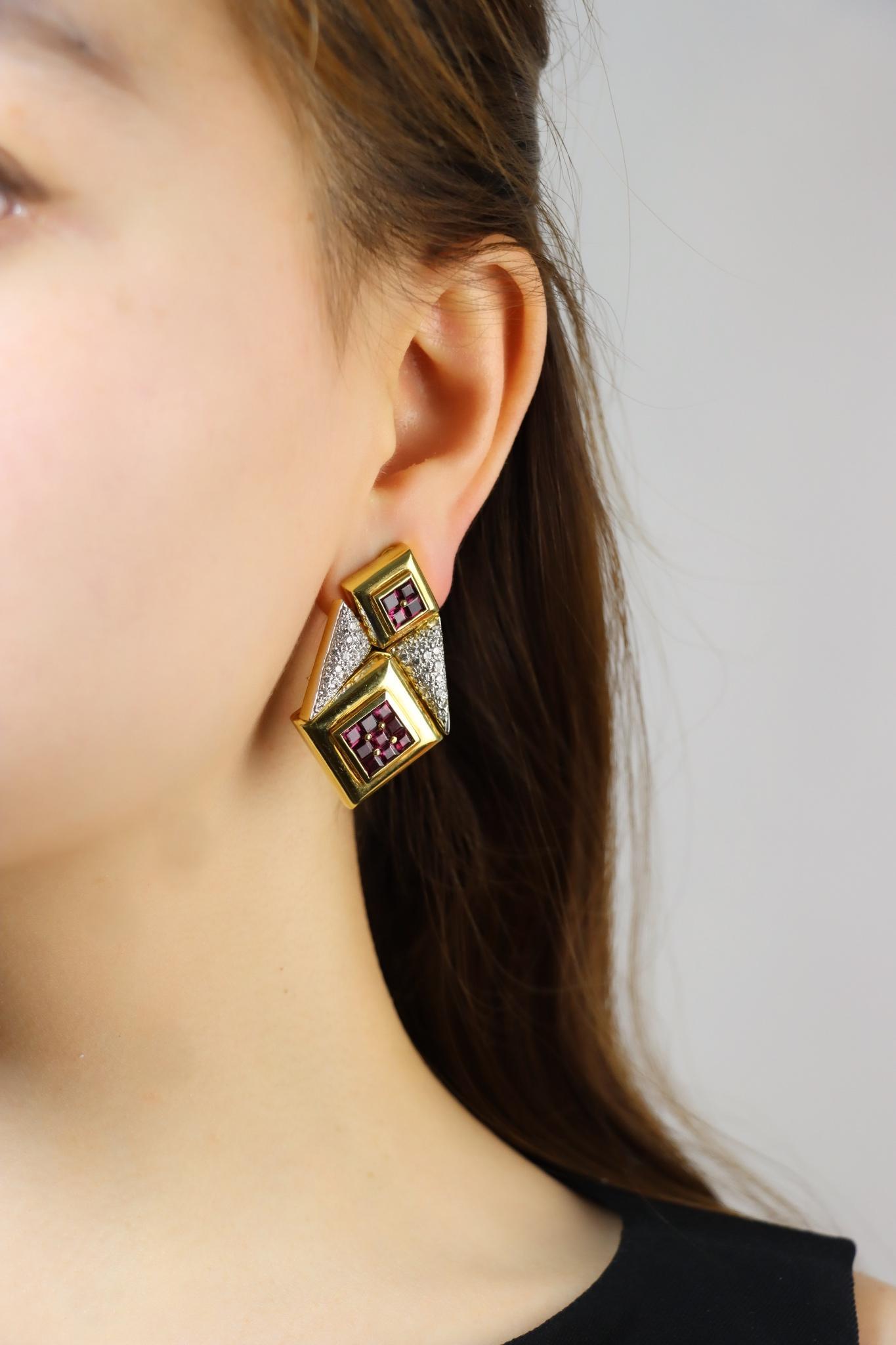 Vintage 18K Gold Diamonds Ruby Geometry Shape Earring

Approximate Dimensions:
4.3 cm (Length) 
2.7 cm (Width)
Approx. 1.2 carats (Diamond)
Approx. 7.8 carats (Ruby)
49.8 grams in weight.

* All dimensions listed above are approximations based on