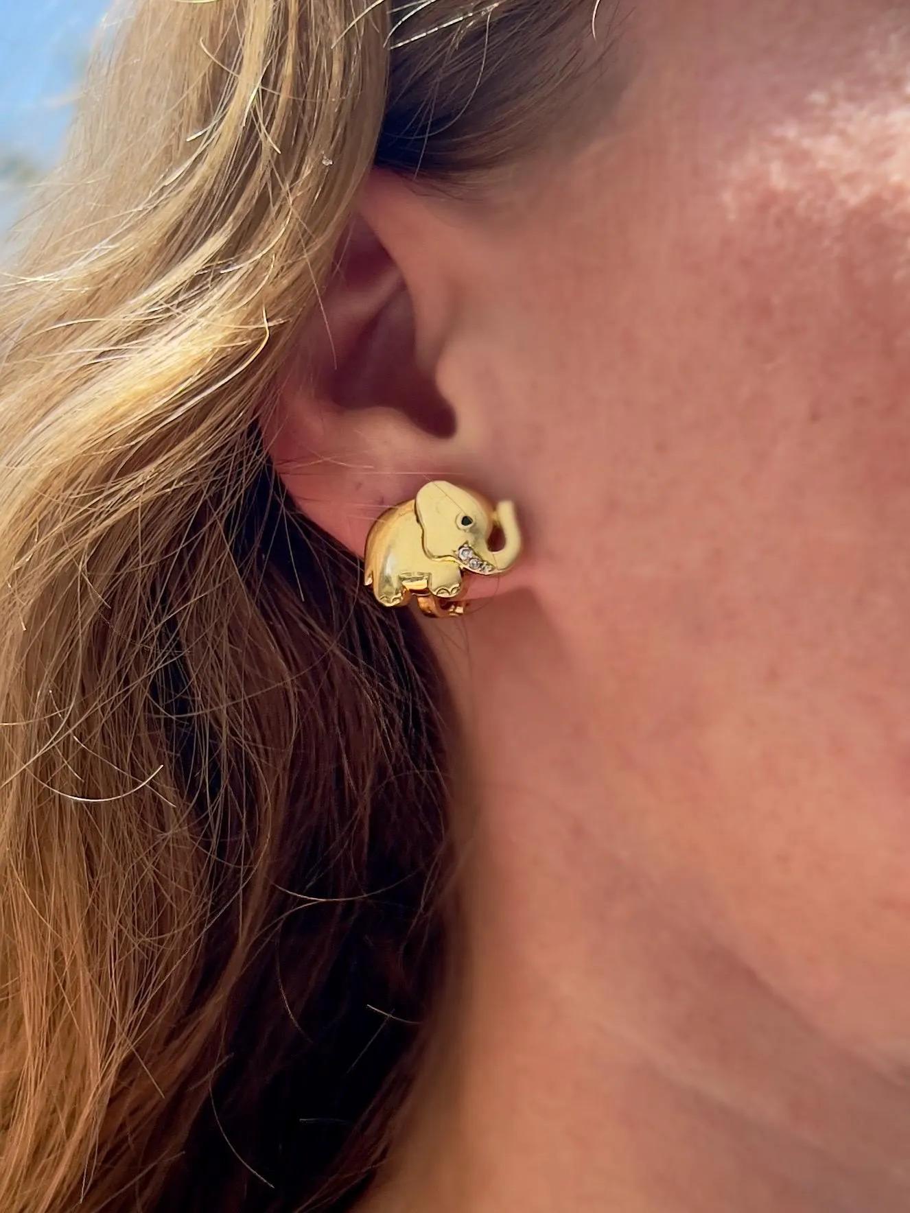 Whimsical, symbolic, and exquisitely made, these vintage Oj Perrin elephant earrings are a rare find for collectors and lovers of fine animal jewelry.

Crafted in 18k yellow gold, each elephant is detailed with a natural emerald eye and sparkling
