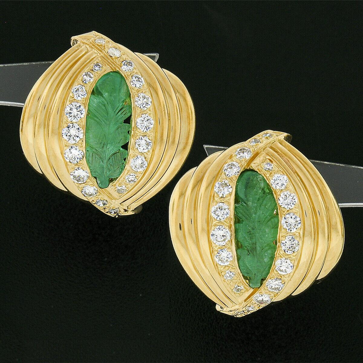Here we have an absolutely elegant pair of vintage earrings that are crafted from solid 18k yellow gold featuring a domed and grooved design with a carved natural emerald gemstone at their center that are nicely framed with very fine quality