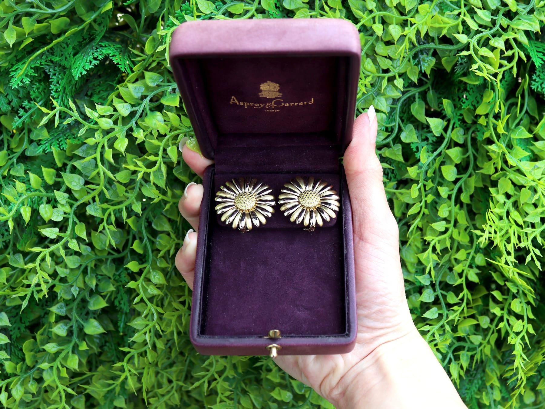 An exceptional, fine and impressive pair of vintage 18 karat yellow and white gold floral earrings made by Asprey and Garrard; part of our diverse vintage gold earring collections.

These exceptional, fine and impressive vintage gold earrings have
