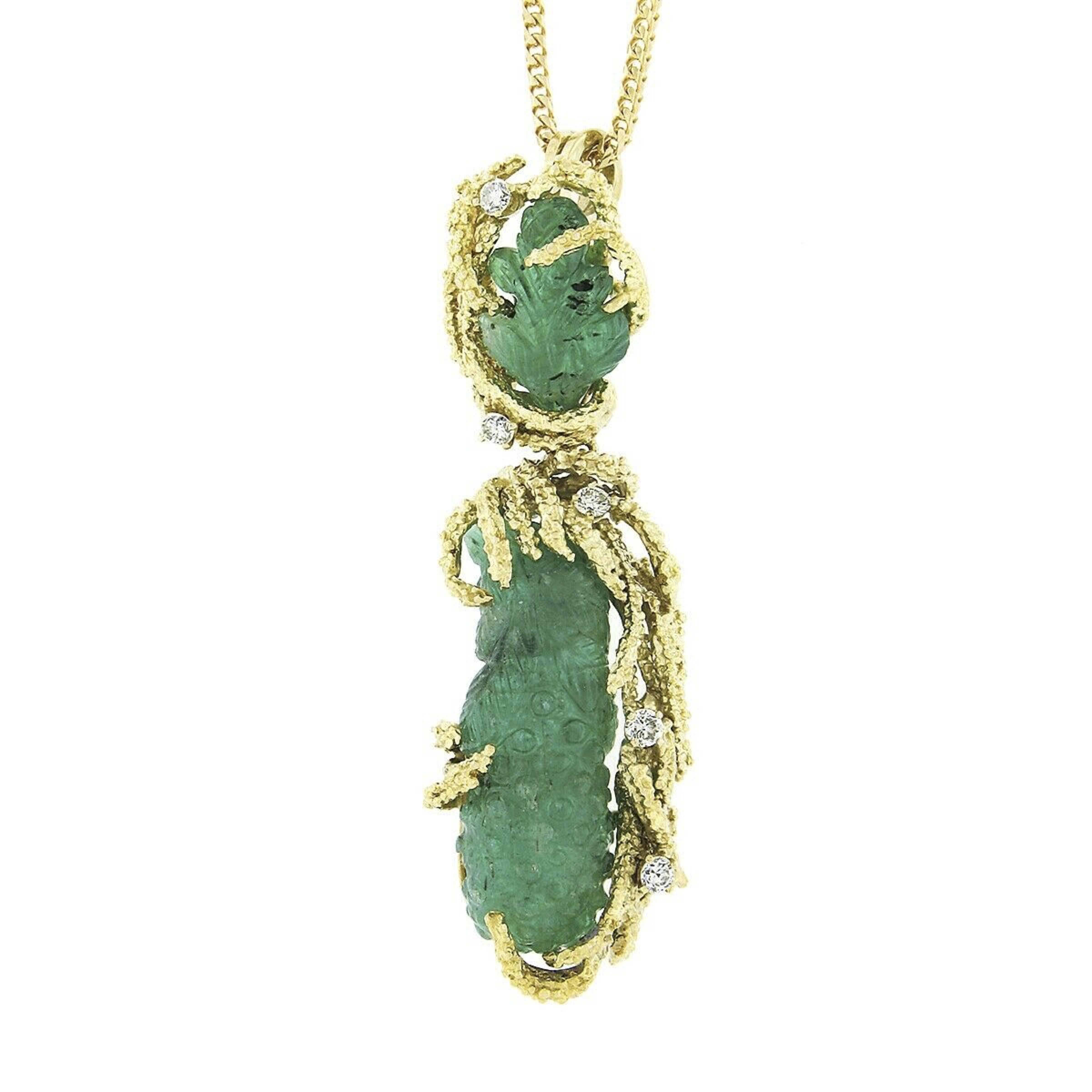 Here we have a magnificent vintage pendant that was crafted from solid 18k yellow gold. It features a drop dangle style that carries two fine emeralds, one of which is GIA certified, and diamonds accents throughout. The emeralds show a deep green