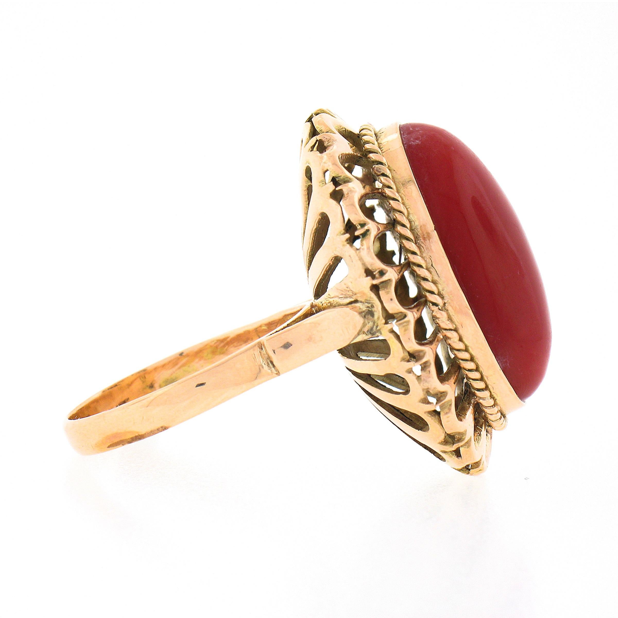 Vintage 18k Gold GIA Oval Cabochon Orangy-Red Coral w/ Open Work Frame Ring In Good Condition For Sale In Montclair, NJ