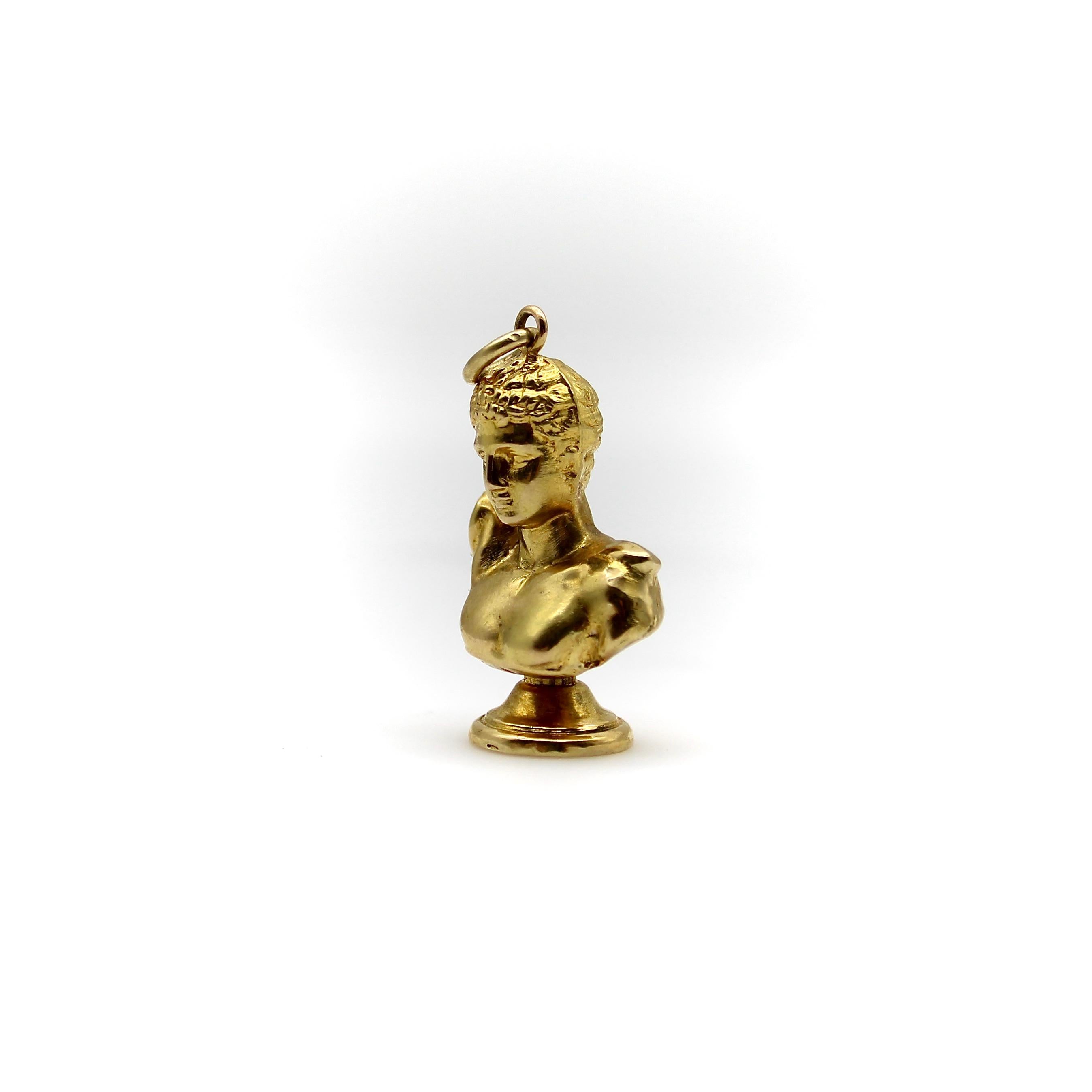Kirsten’s Corner has a soft spot for the classics in our inventory and we are often drawn towards classical renditions of ancient sights. This piece is a very handsome 18k gold bust modeled after Hermes of Olympia, a sculpture found in the