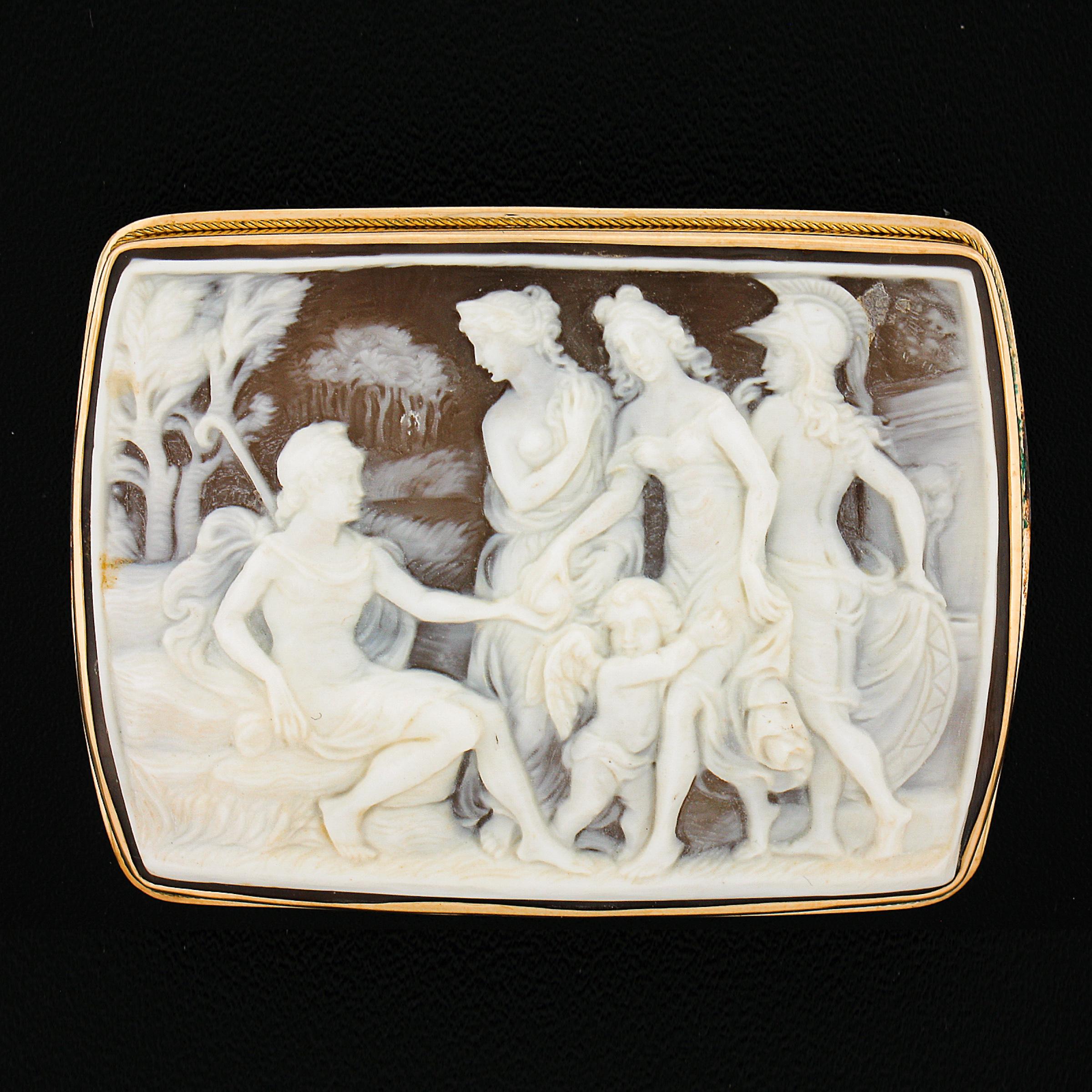 --Stone(s):--
(1) Carved Shell Cameo - Rectangular Shaped - Bezel Set - Light Brown w/ White Color Carving - 42.6x55.1mm (approx.)

Material: 18k Solid Yellow Gold
Total Weight: 17.4 Grams
Overall Height: 44.1mm (1.7