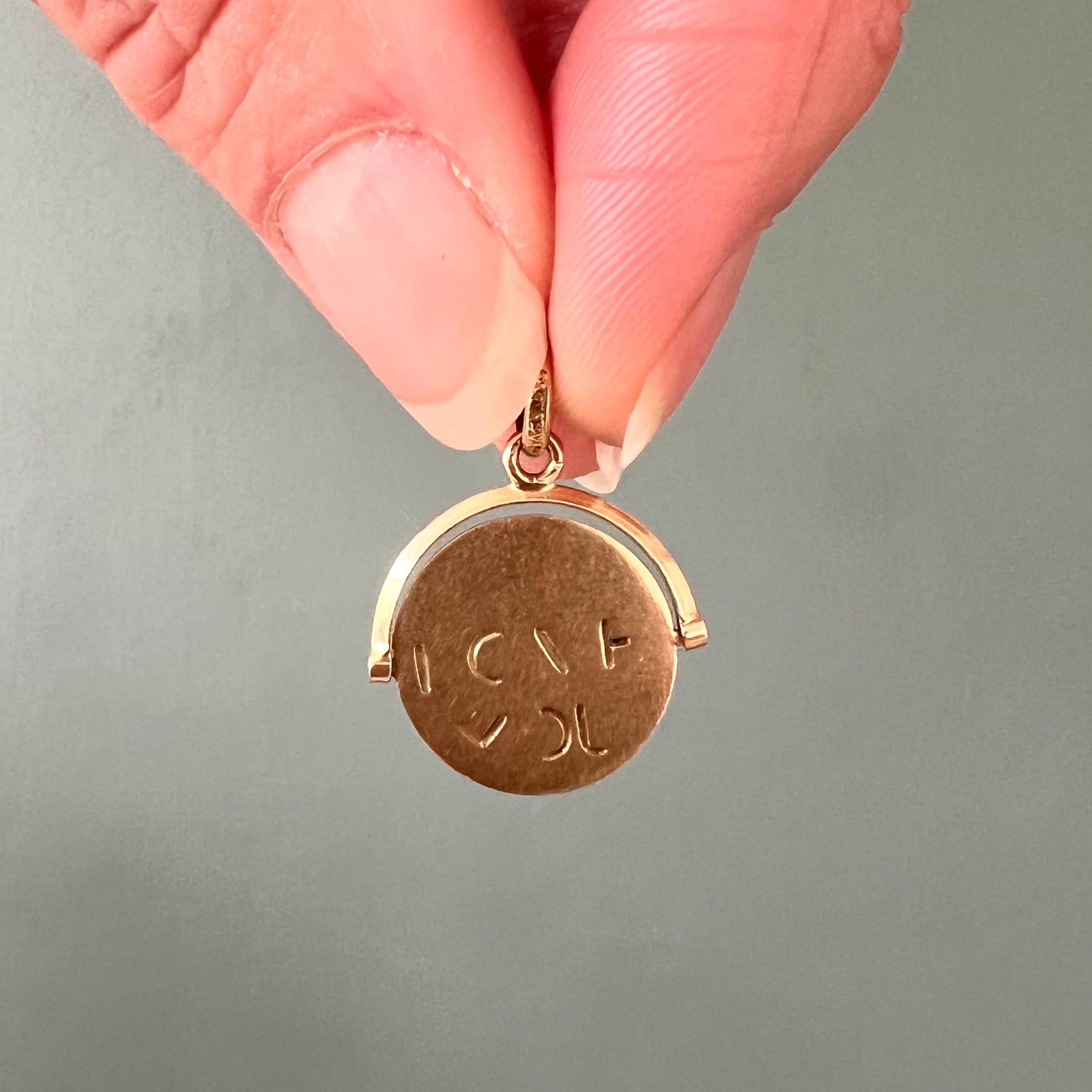 This is an 18 karat yellow gold vintage I Love You spinner charm. This cute love disc charm can spin - so you can see I love you emerge. What better way to make it known that you love someone! Give the disc a whirl and the words I Love You will