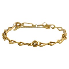 Pulsera de cadena de eslabones curvados con nudo de oro vintage de 18 quilates